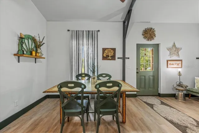 a view of a house with swimming pool and porch with furniture