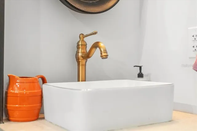 an aerial view of residential house with outdoor space and trees all around