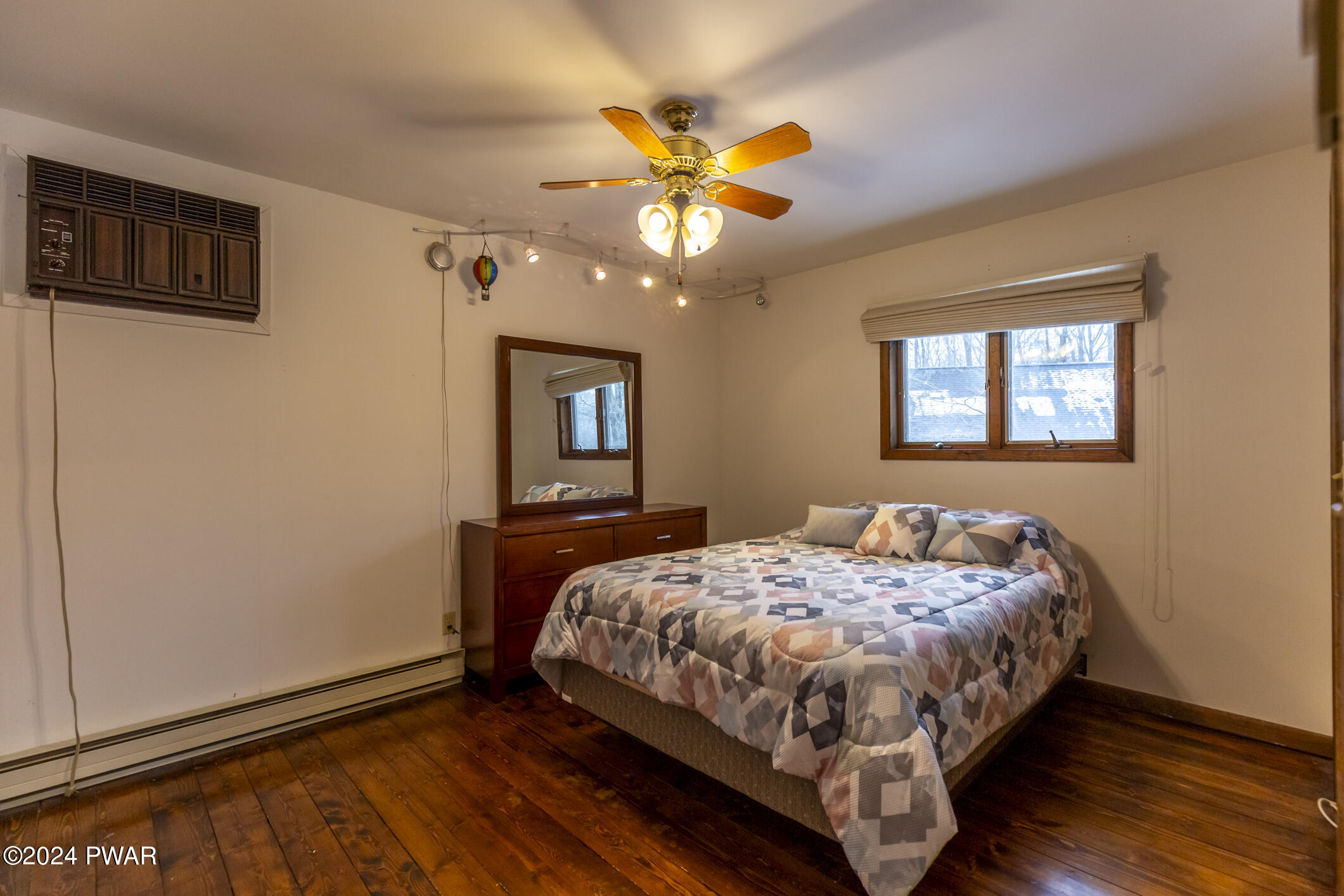 365 Northgate Road Lake Ariel, PA 18436 - Photo 35 of 68 a bedroom with a bed chandelier and a window