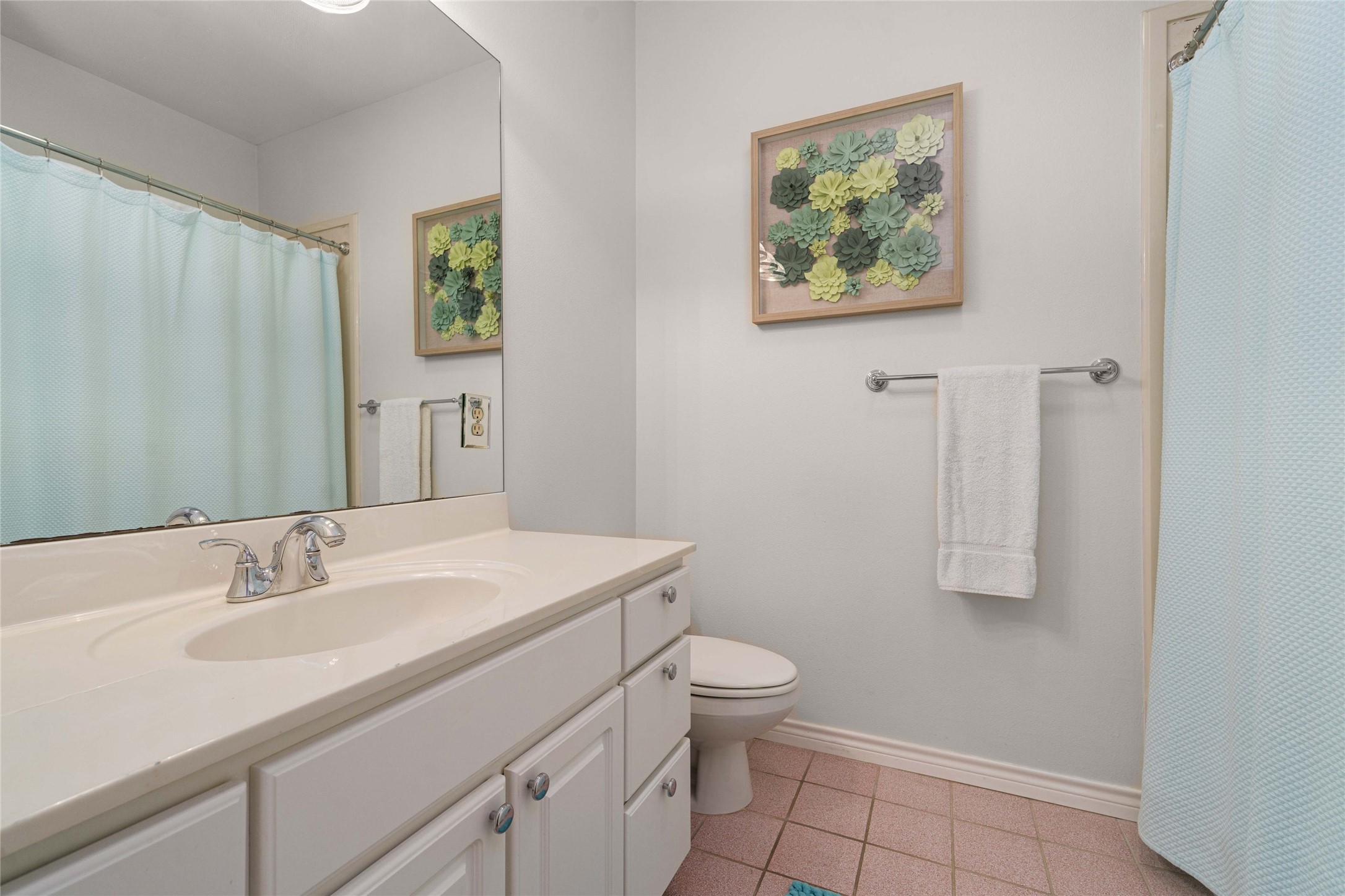 2102 Paisano Road Austin, TX 78746 - Photo 14 of 26 Bathroom featuring a shower with curtain, vanity, and light tile patterned floors