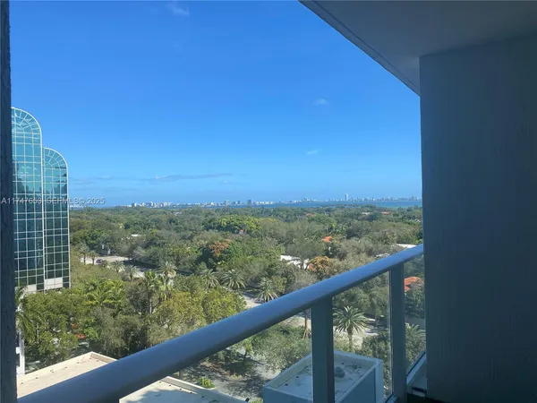 a view of city and green space