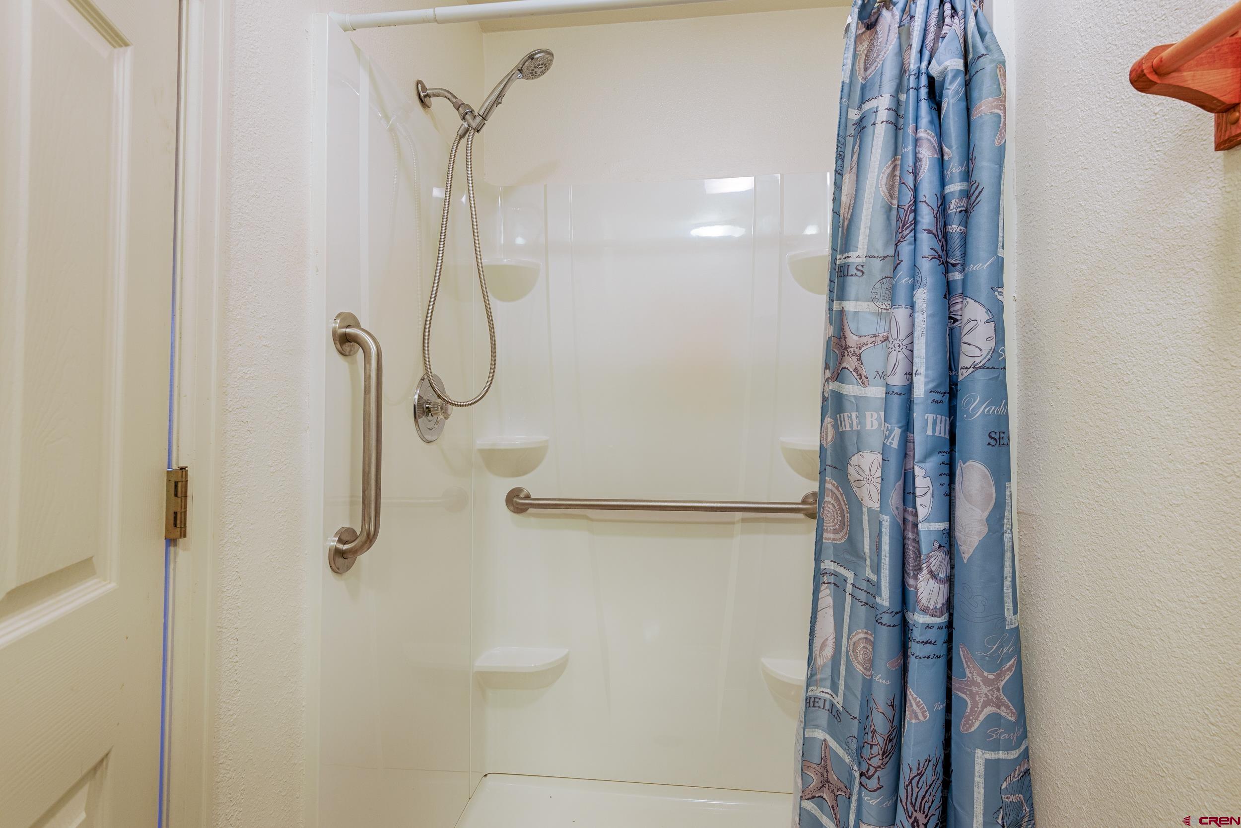 1686 Rheims Court Montrose, CO 81401 - Photo 15 of 18 a bathroom with a shower