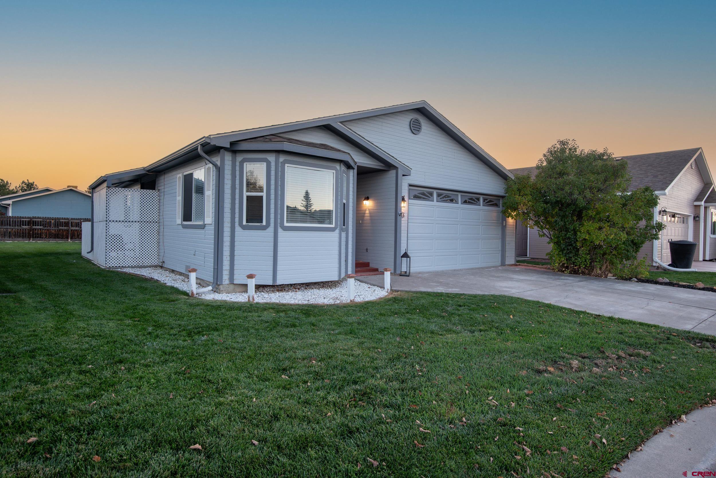 1686 Rheims Court Montrose, CO 81401 - Photo 17 of 18 a house view with a outdoor space