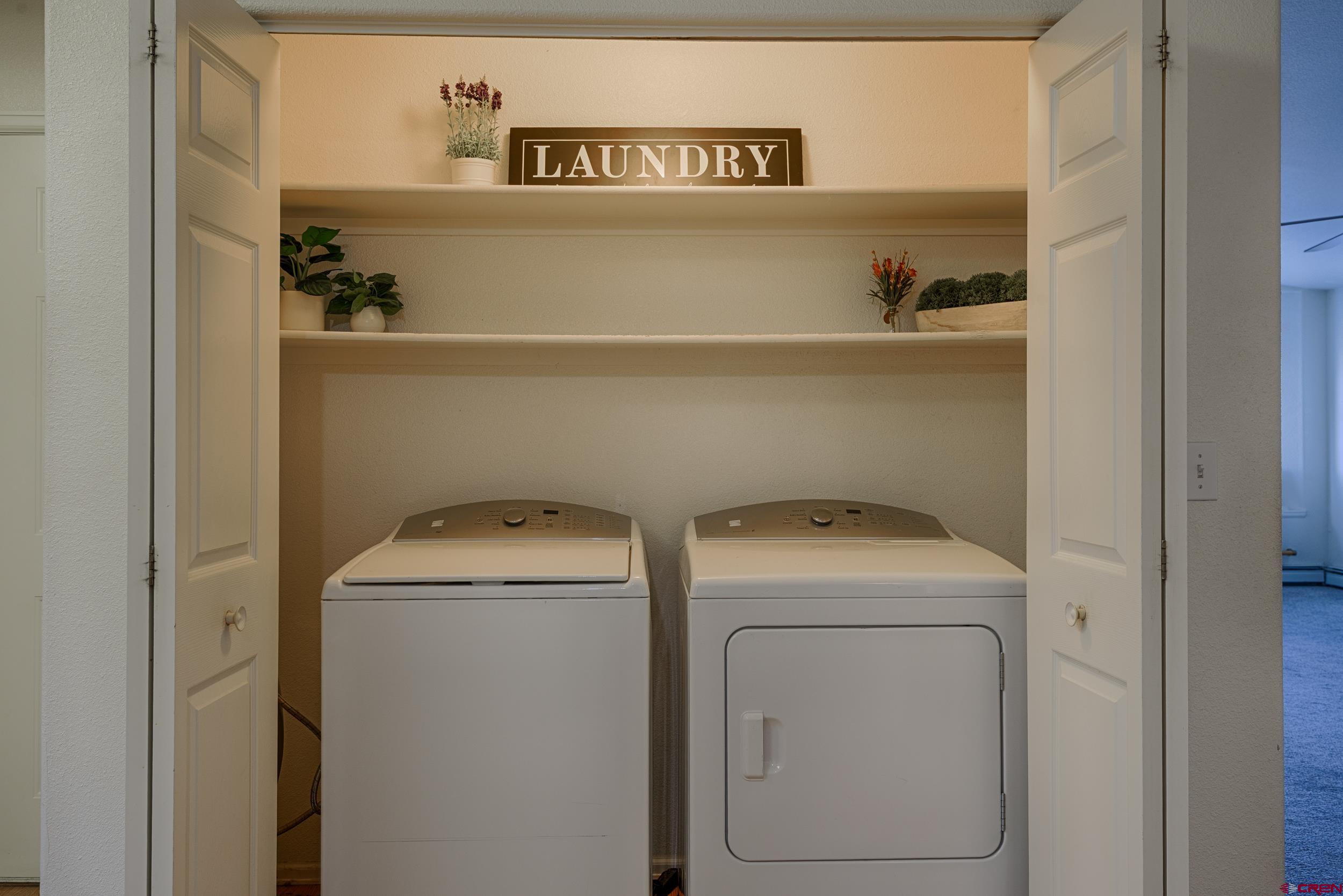 1686 Rheims Court Montrose, CO 81401 - Photo 9 of 18 a utility room with dryer and washer