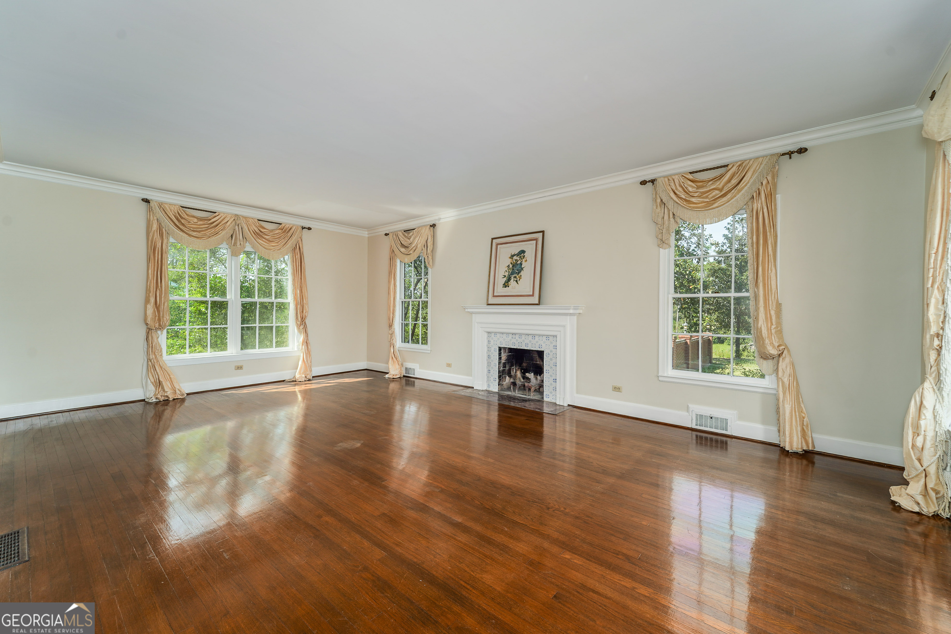 1602 Ward St Extension West Douglas, GA 31533 - Photo 18 of 70 a view of empty room with wooden floor and fireplace