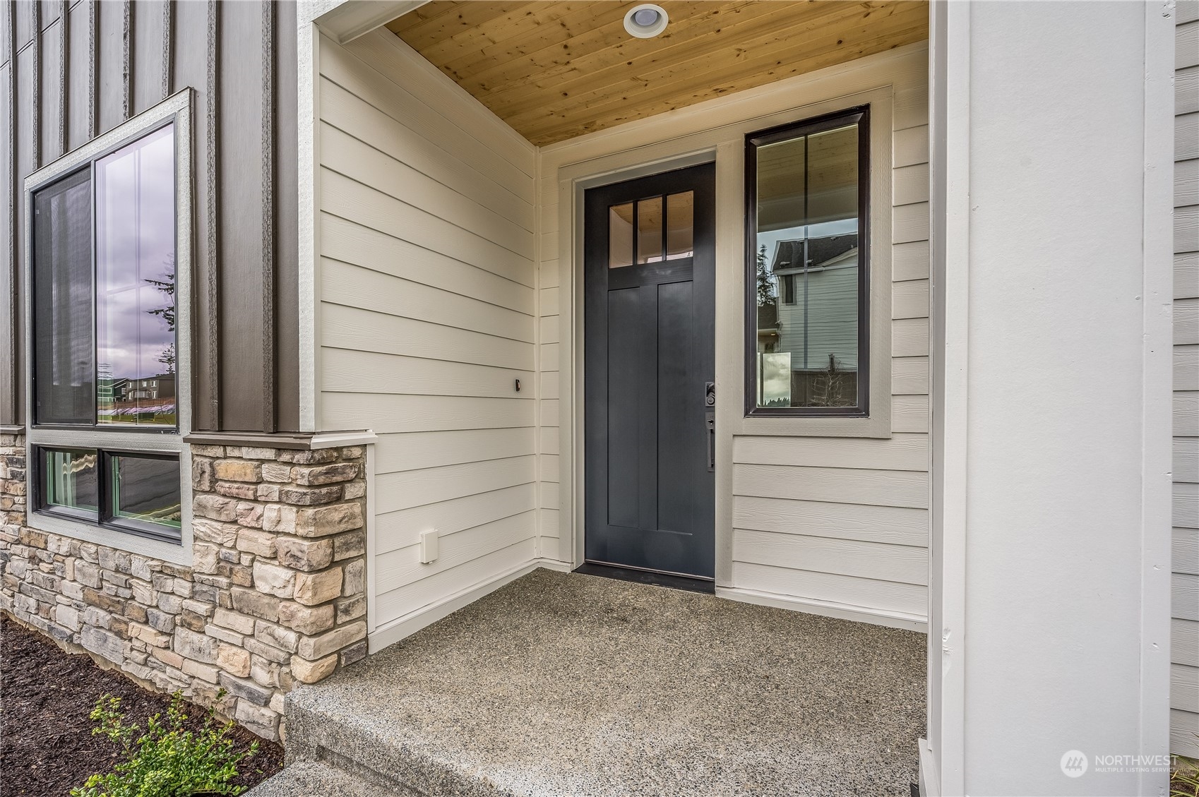 4321 243rd Place Southeast, Unit LOT31 Bothell, WA 98021 - Photo 3 of 35 a view of front door of house