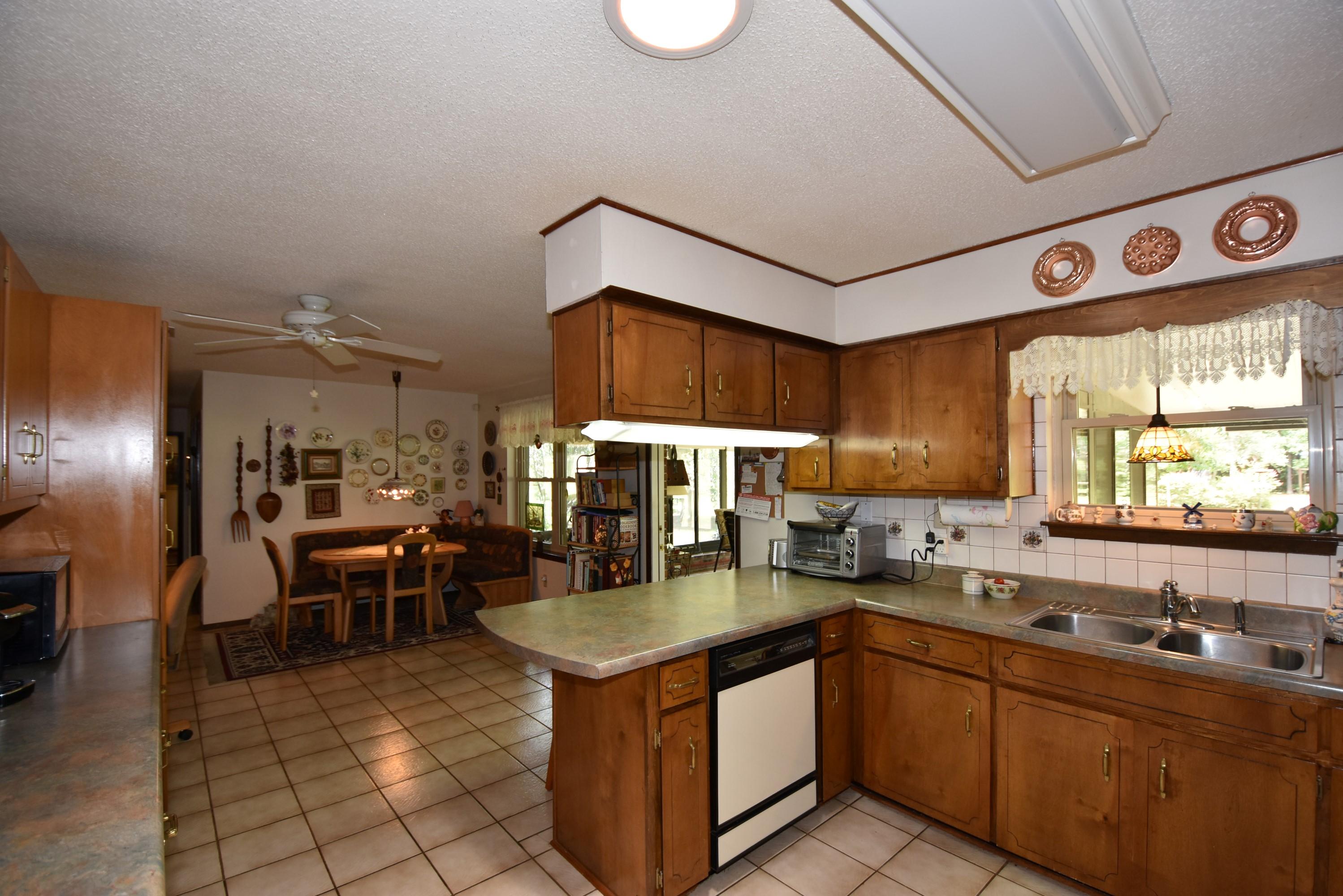 6008 Old Hickory Road Crestview, FL 32539 - Photo 13 of 57 a kitchen with stainless steel appliances granite countertop a sink and cabinets