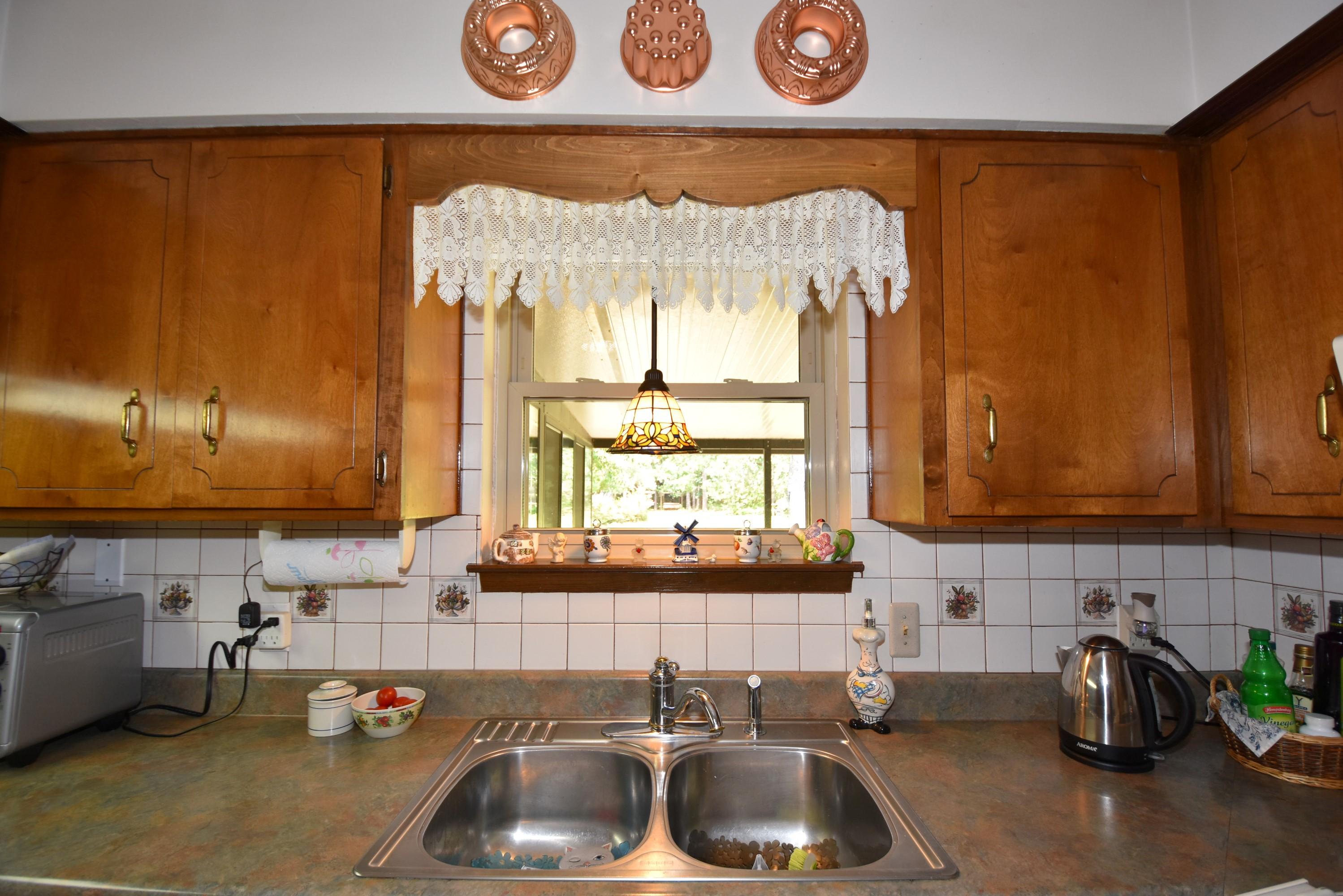 6008 Old Hickory Road Crestview, FL 32539 - Photo 14 of 57 a kitchen with a sink and a window