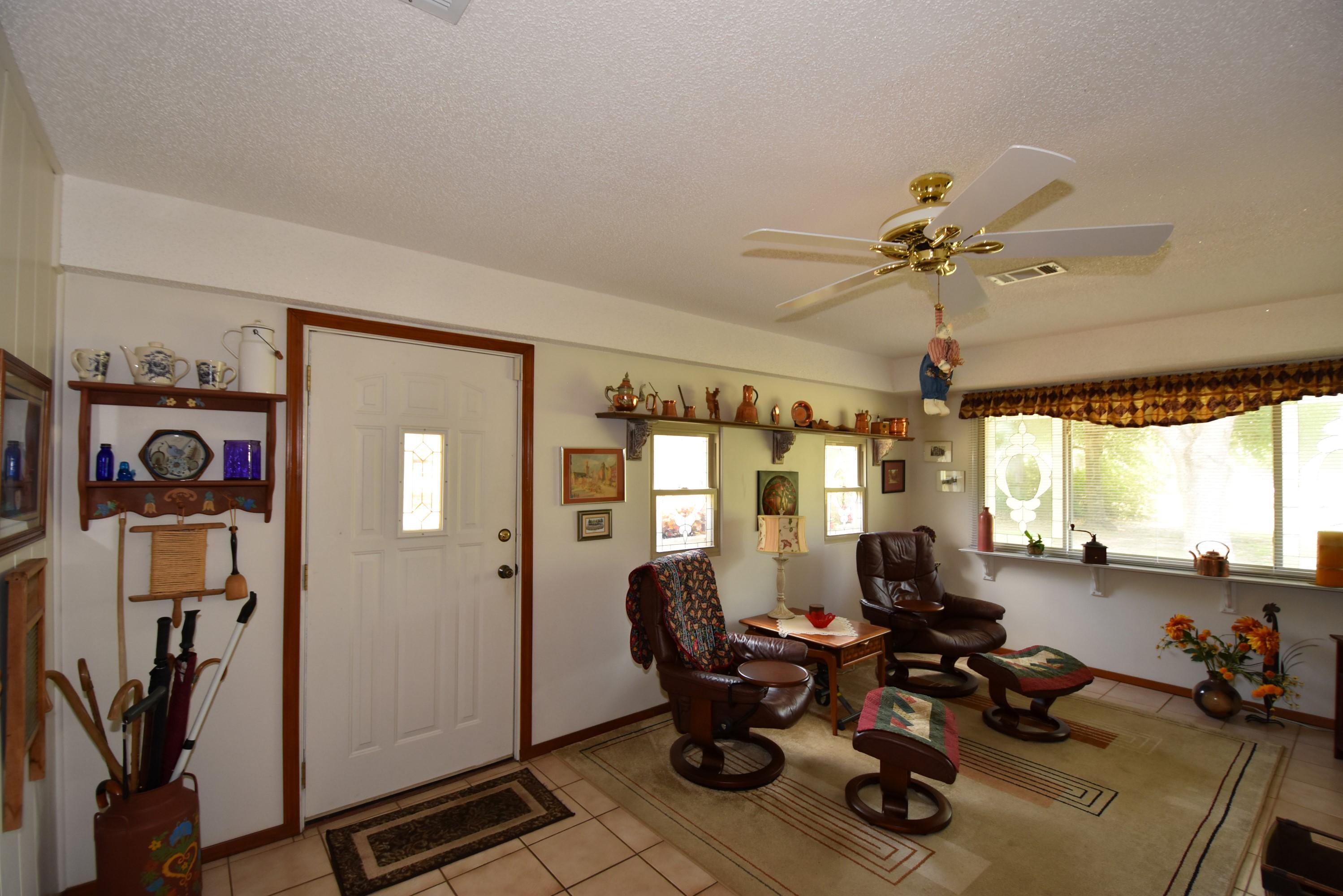 6008 Old Hickory Road Crestview, FL 32539 - Photo 15 of 57 a living room with lots of furniture and a ceiling fan