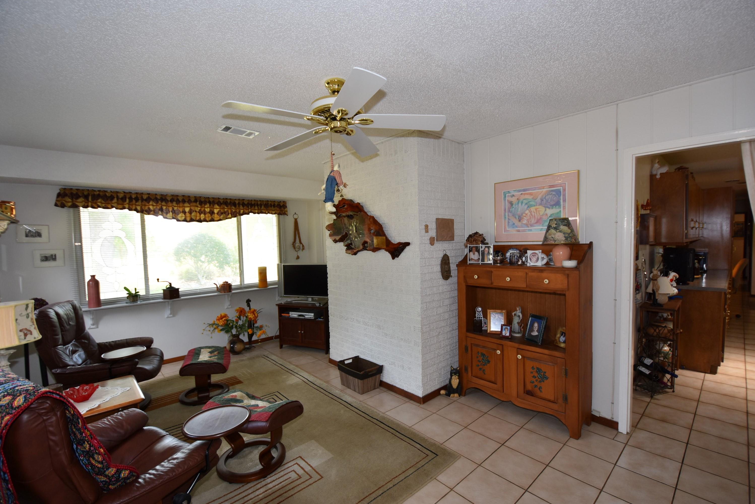 6008 Old Hickory Road Crestview, FL 32539 - Photo 16 of 57 a living room with furniture and a large window