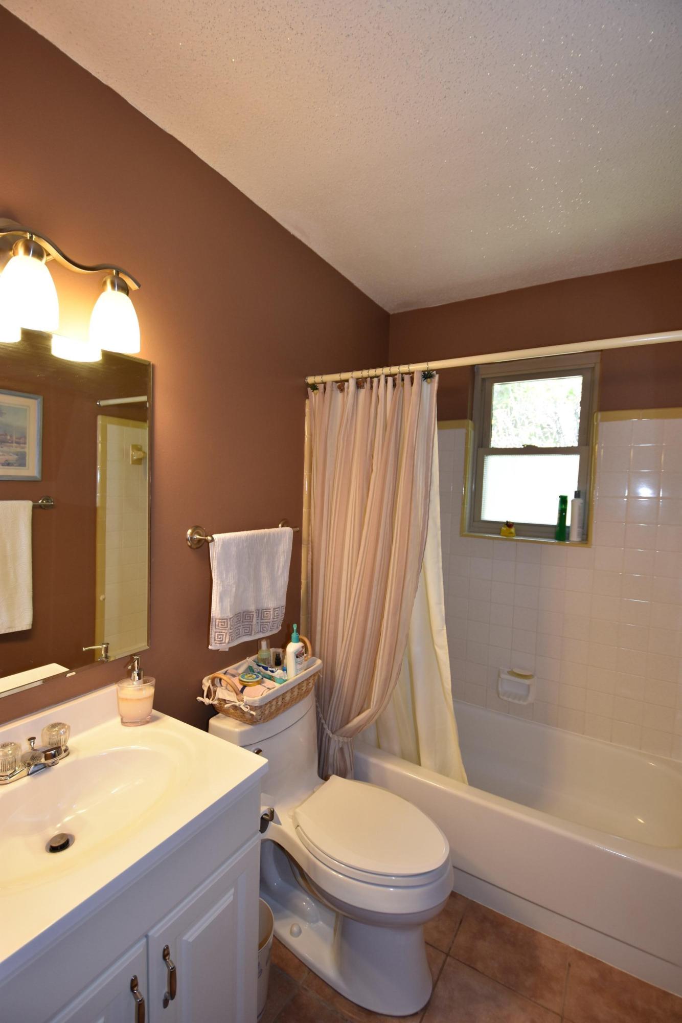 6008 Old Hickory Road Crestview, FL 32539 - Photo 18 of 57 a bathroom with a sink toilet and shower