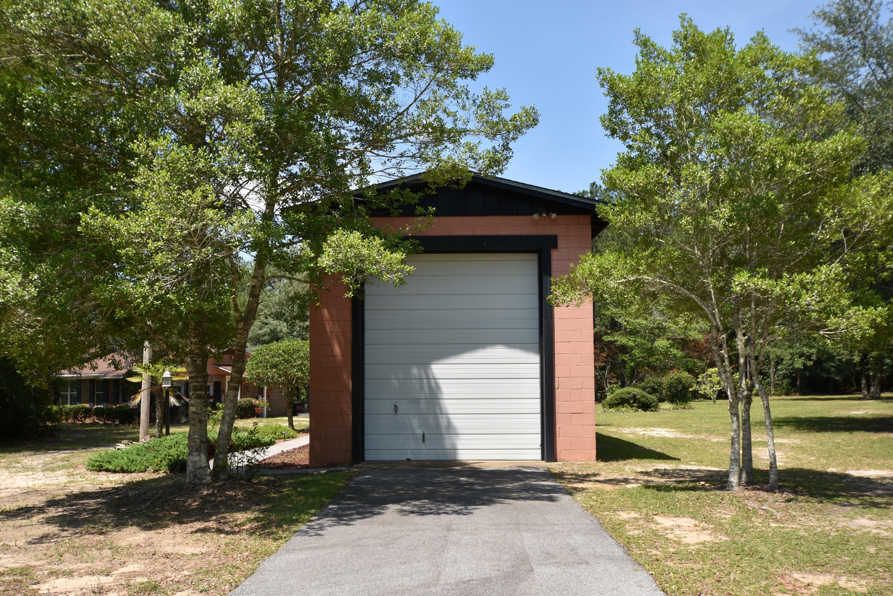 6008 Old Hickory Road Crestview, FL 32539 - Photo 2 of 57 a front view of a house with a yard