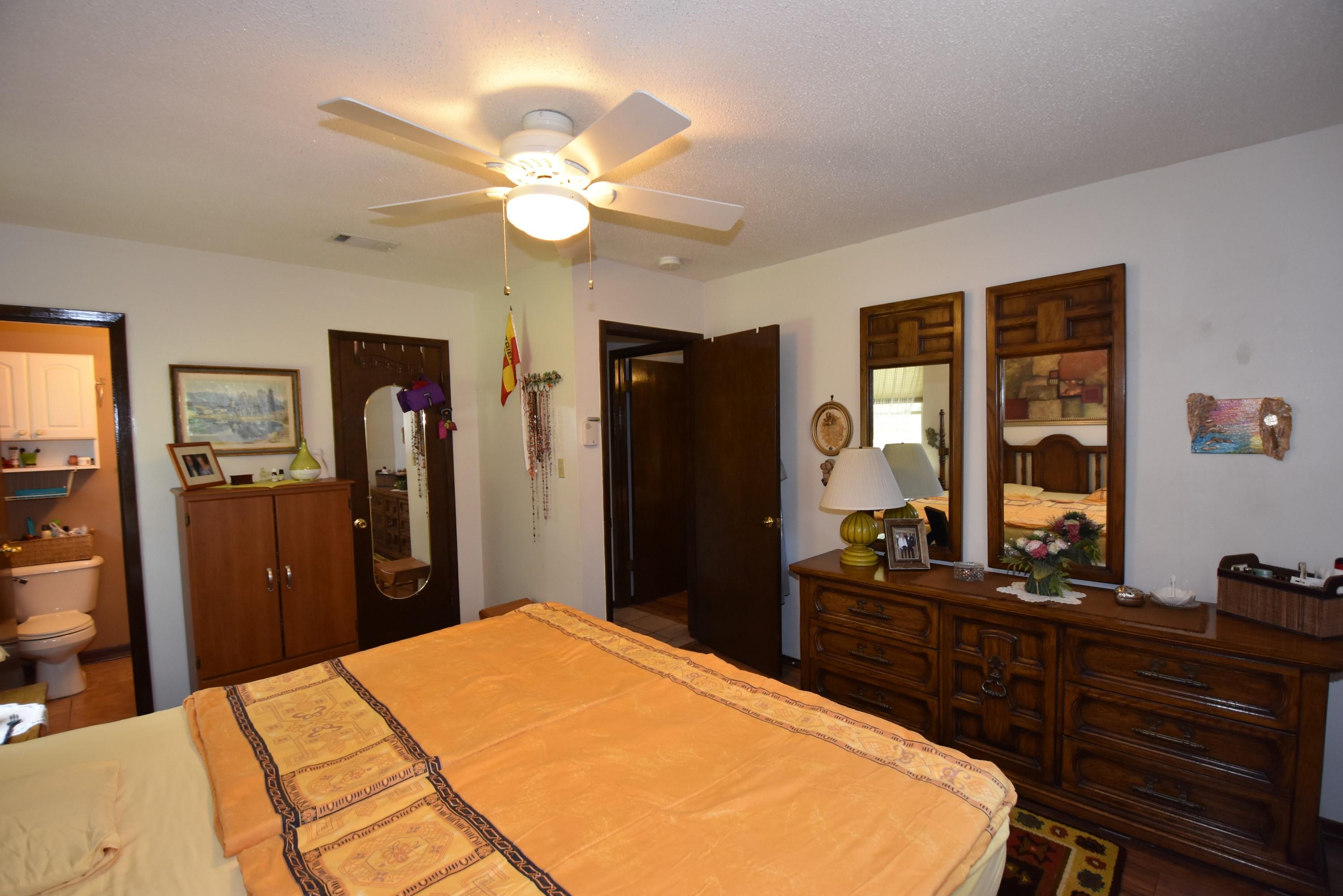6008 Old Hickory Road Crestview, FL 32539 - Photo 22 of 57 a bedroom with a bed and a dresser