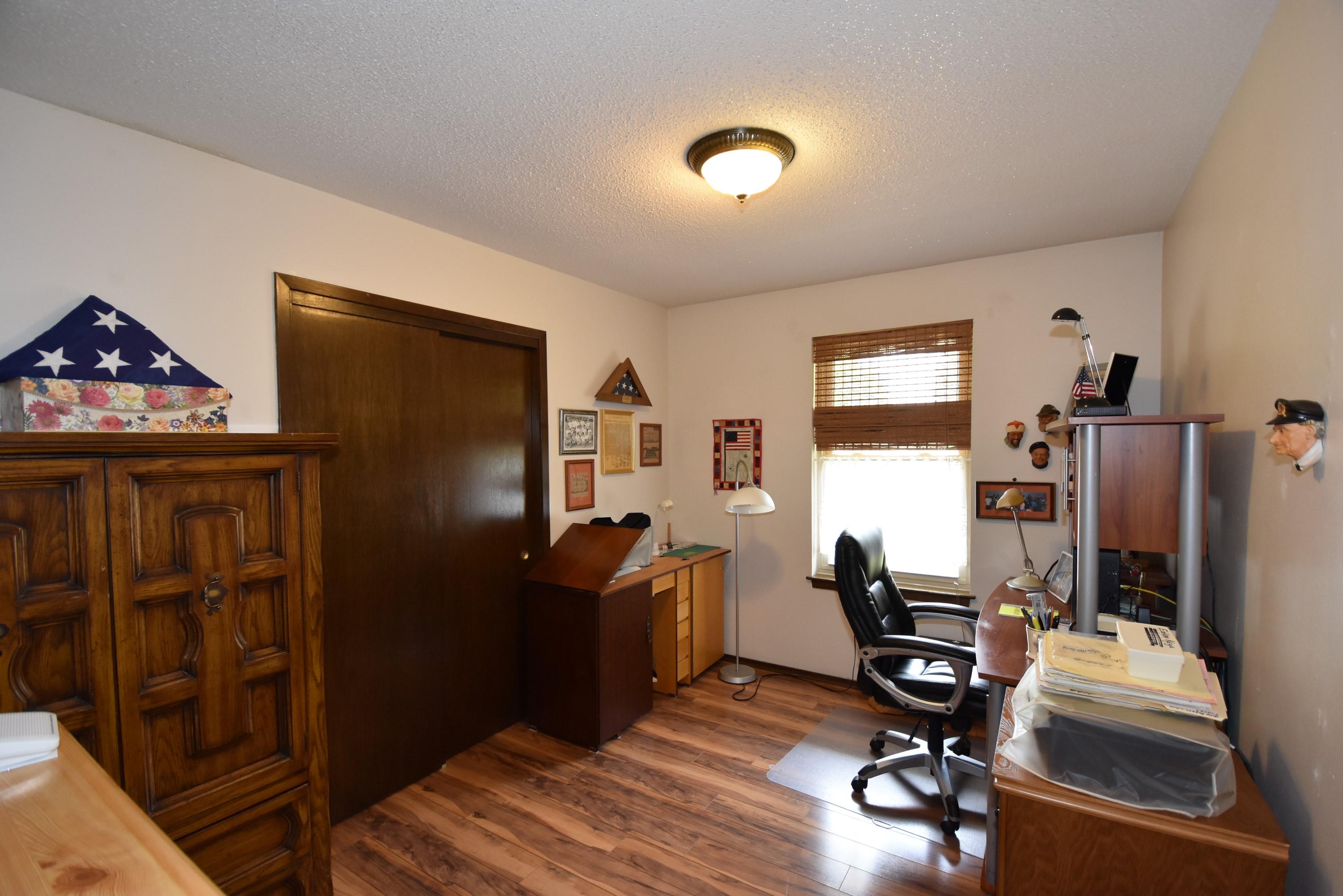 6008 Old Hickory Road Crestview, FL 32539 - Photo 26 of 57 a view of a workspace with furniture and wooden floor