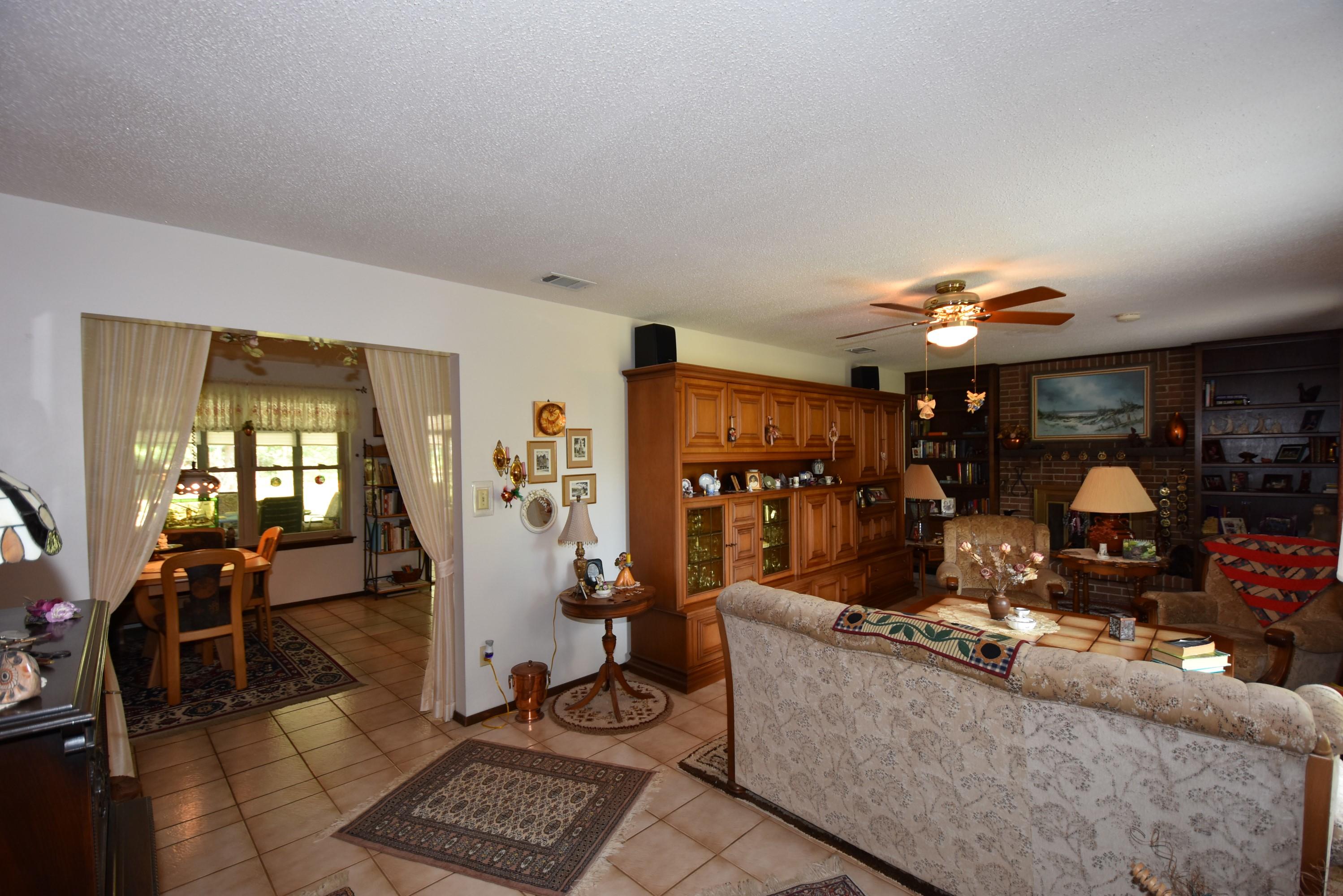 6008 Old Hickory Road Crestview, FL 32539 - Photo 4 of 57 a living room with furniture and a flat screen tv