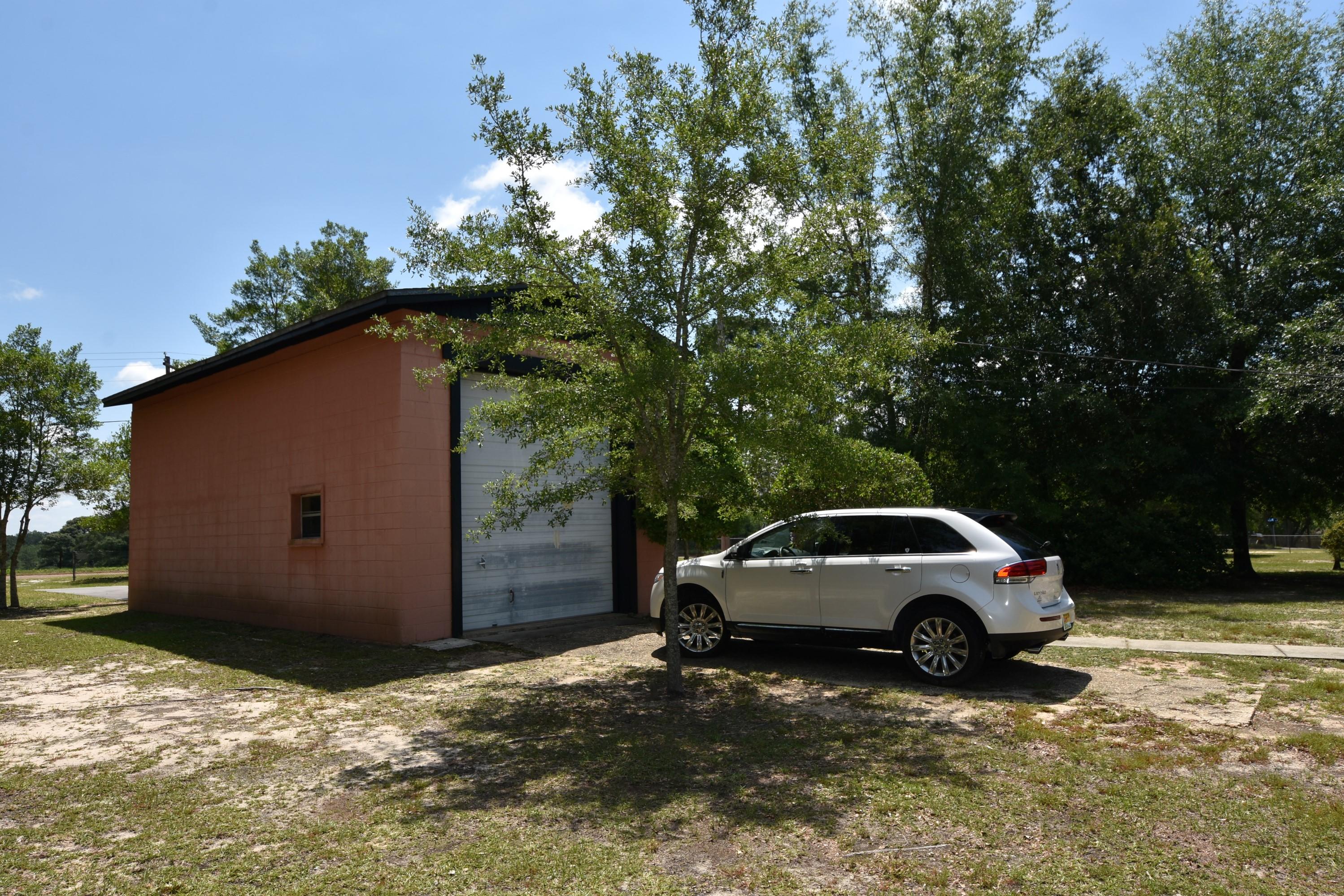6008 Old Hickory Road Crestview, FL 32539 - Photo 41 of 57 a view of a car parked in a yard