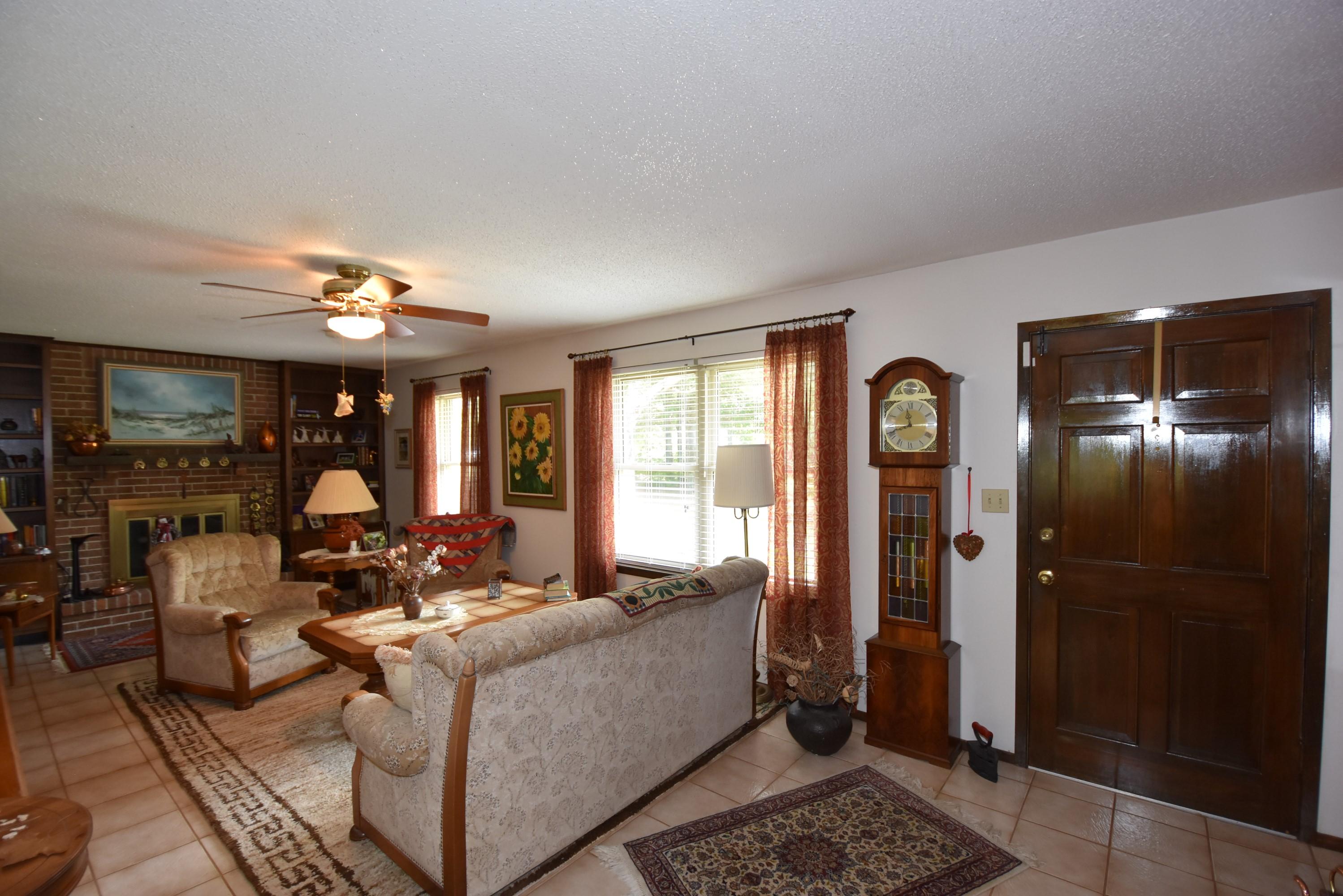 6008 Old Hickory Road Crestview, FL 32539 - Photo 5 of 57 a living room with furniture and chandelier