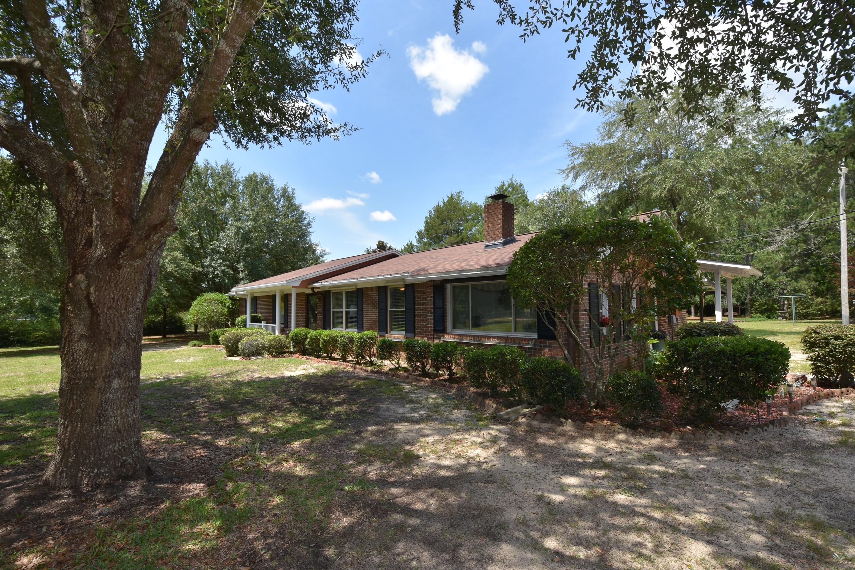 6008 Old Hickory Road Crestview, FL 32539 - Photo 52 of 57 a front view of a house with a yard
