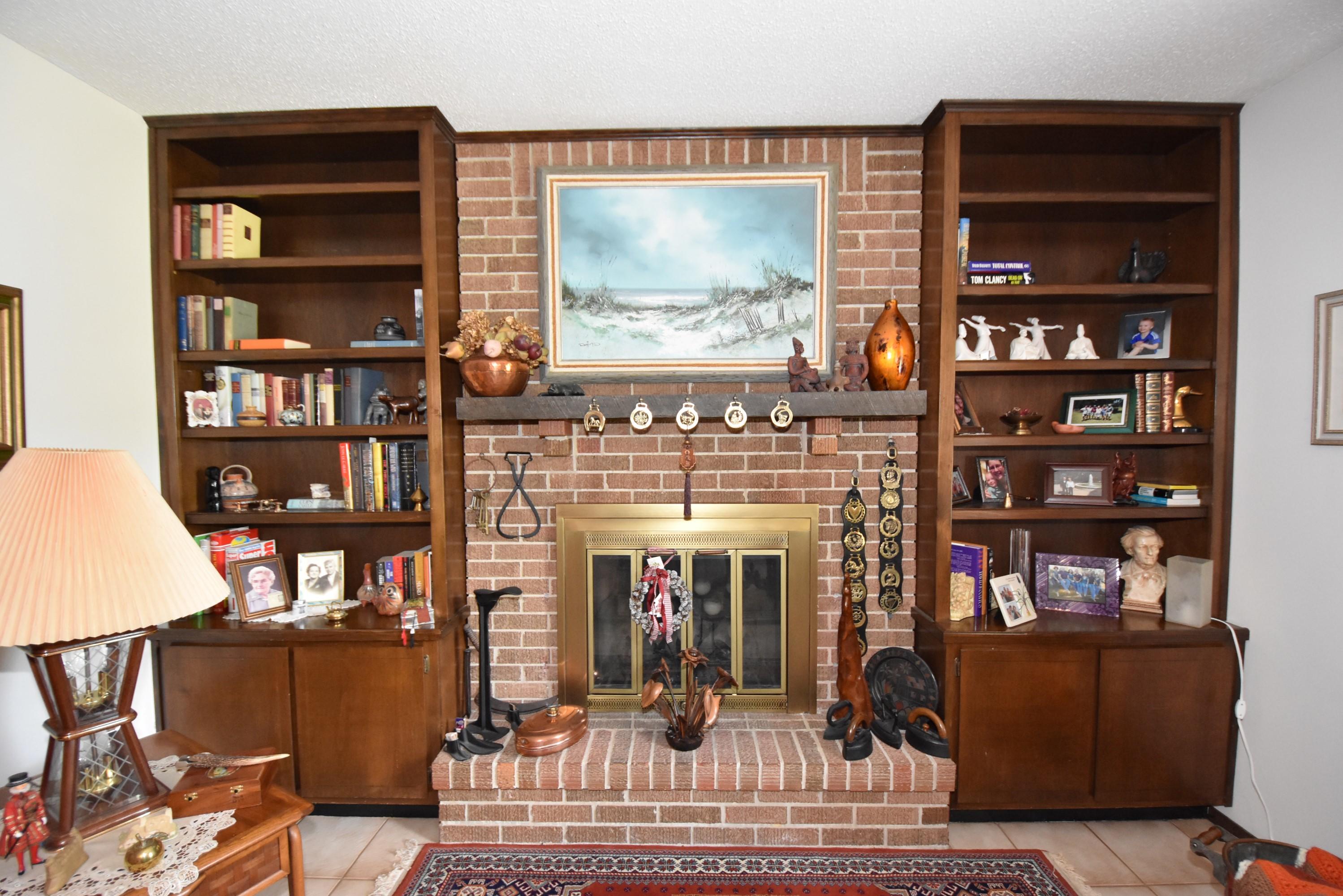 6008 Old Hickory Road Crestview, FL 32539 - Photo 6 of 57 a living room with fireplace furniture and a book shelf