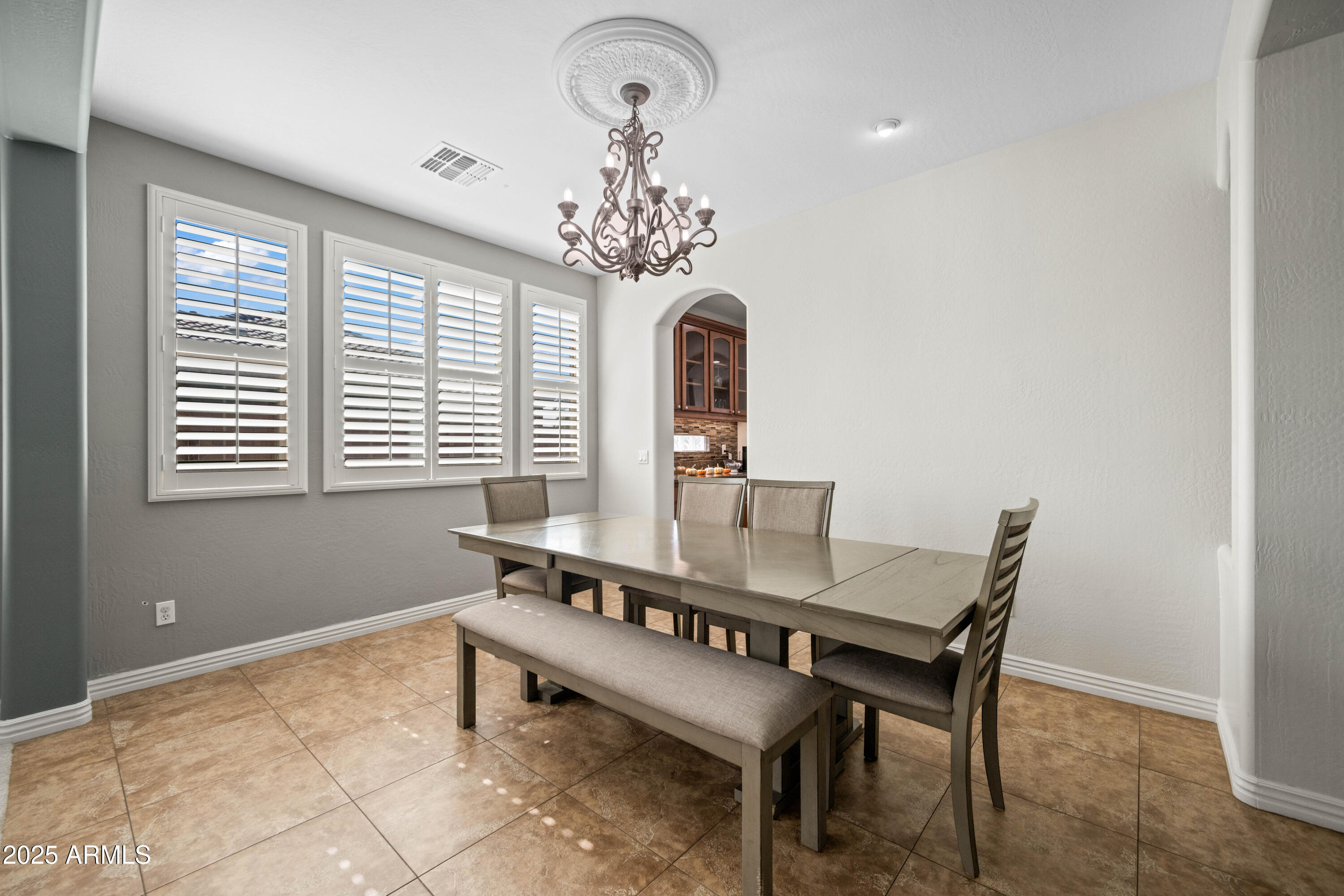 16880 West Jackson Street Goodyear, AZ 85338 - Photo 17 of 86 a dining room with furniture and window