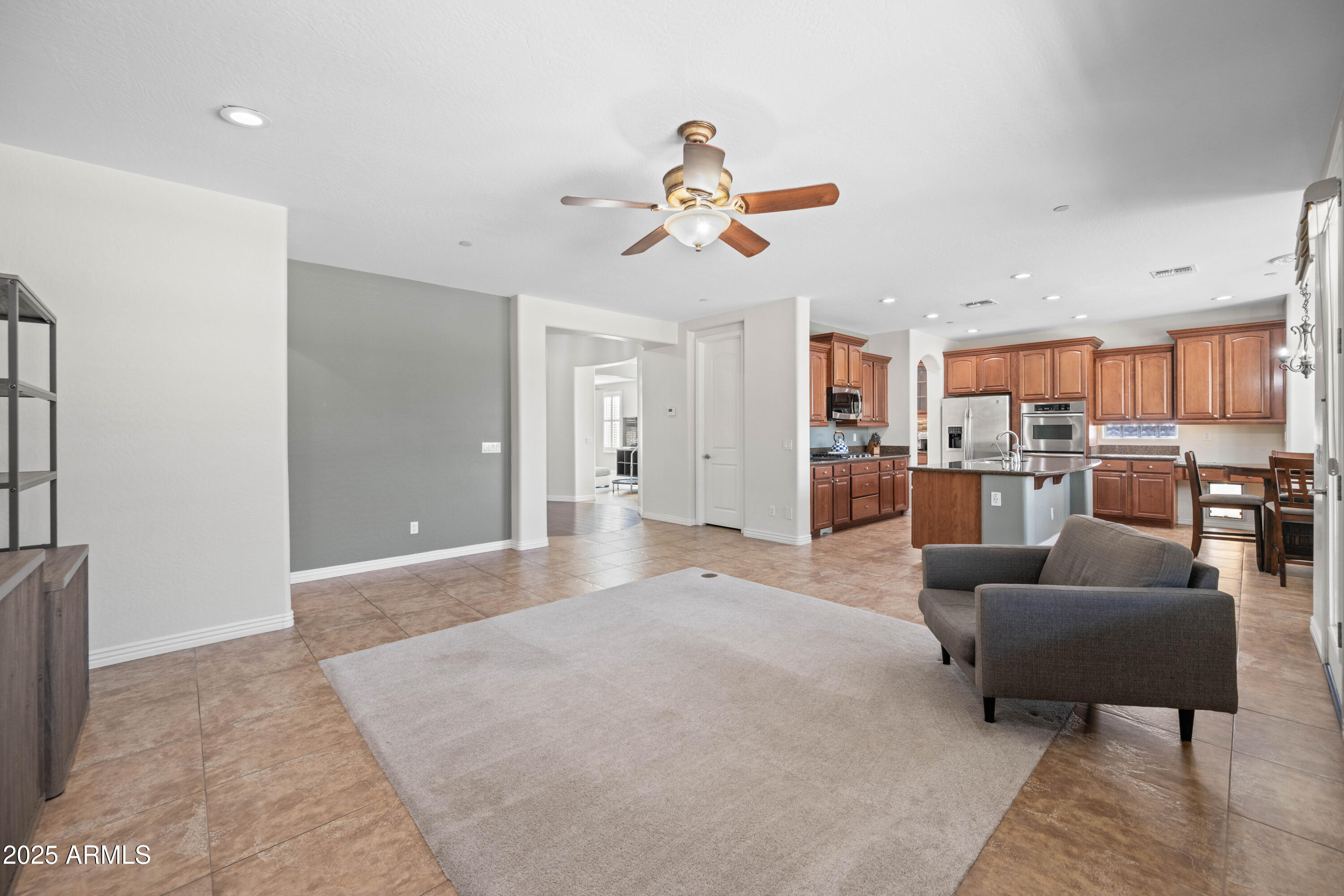16880 West Jackson Street Goodyear, AZ 85338 - Photo 31 of 86 a view of a living room kitchen and a refrigerator