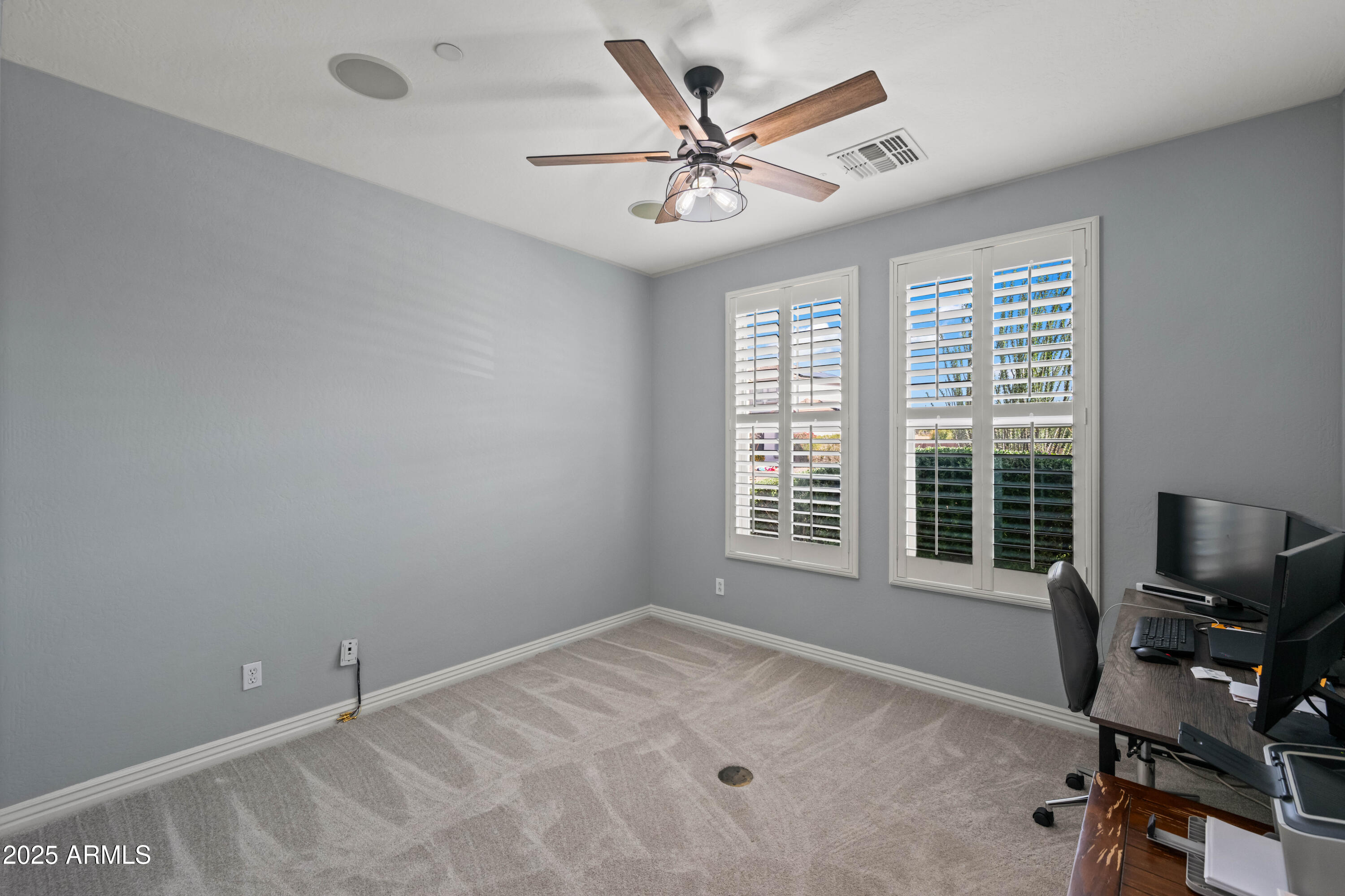 16880 West Jackson Street Goodyear, AZ 85338 - Photo 35 of 86 a view of a workspace with furniture and a window