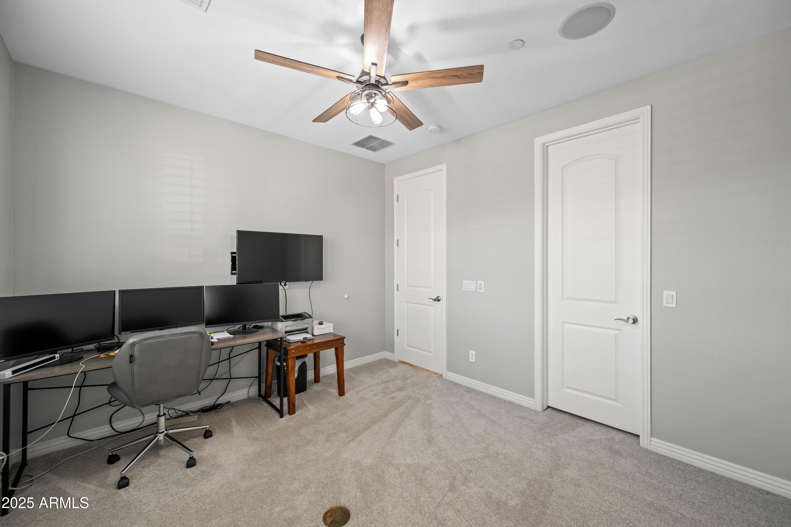 16880 West Jackson Street Goodyear, AZ 85338 - Photo 36 of 86 a view of a workspace with furniture and a window