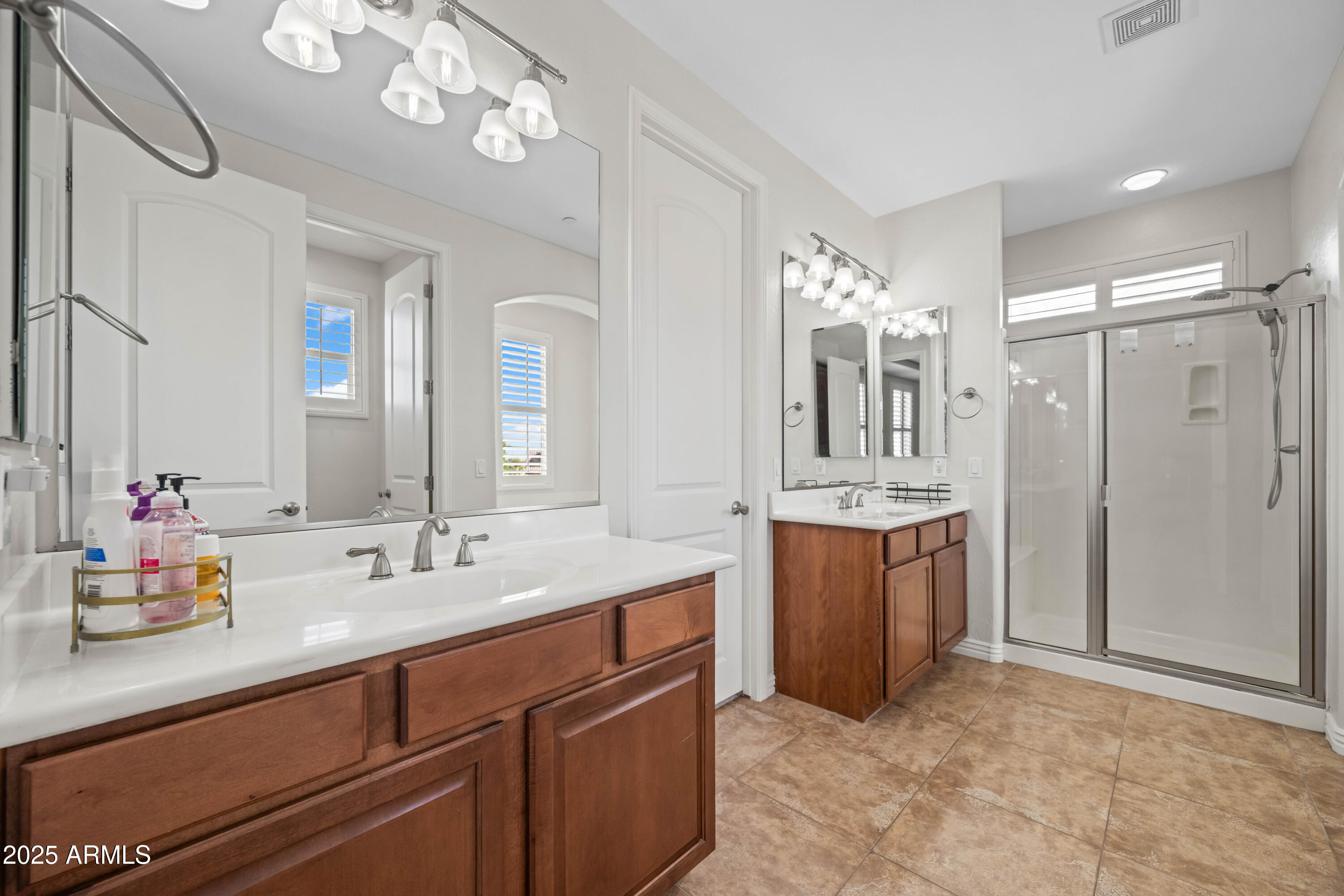 16880 West Jackson Street Goodyear, AZ 85338 - Photo 52 of 86 a spacious bathroom with a double vanity sink mirror and double