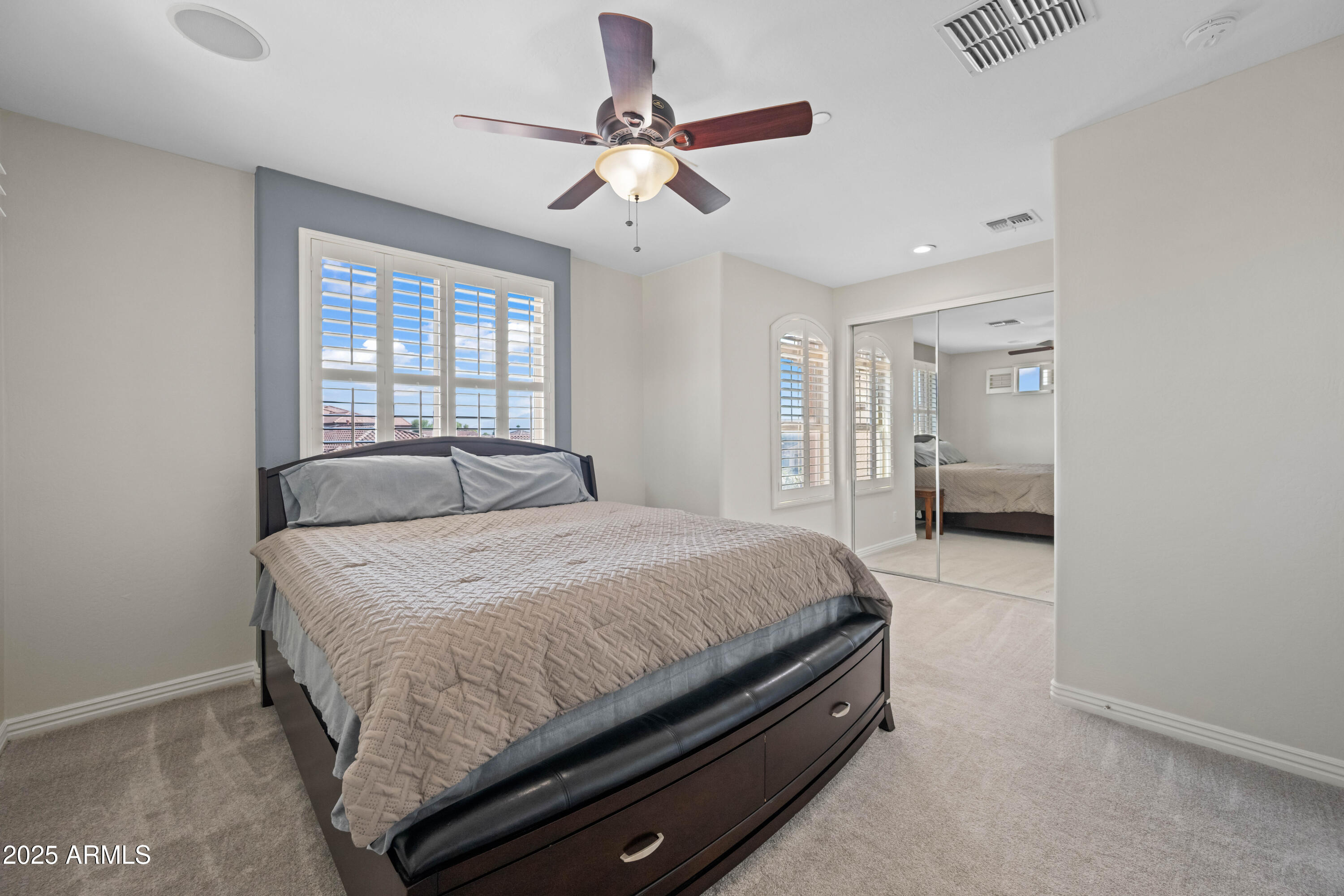 16880 West Jackson Street Goodyear, AZ 85338 - Photo 56 of 86 a bedroom with a bed and window