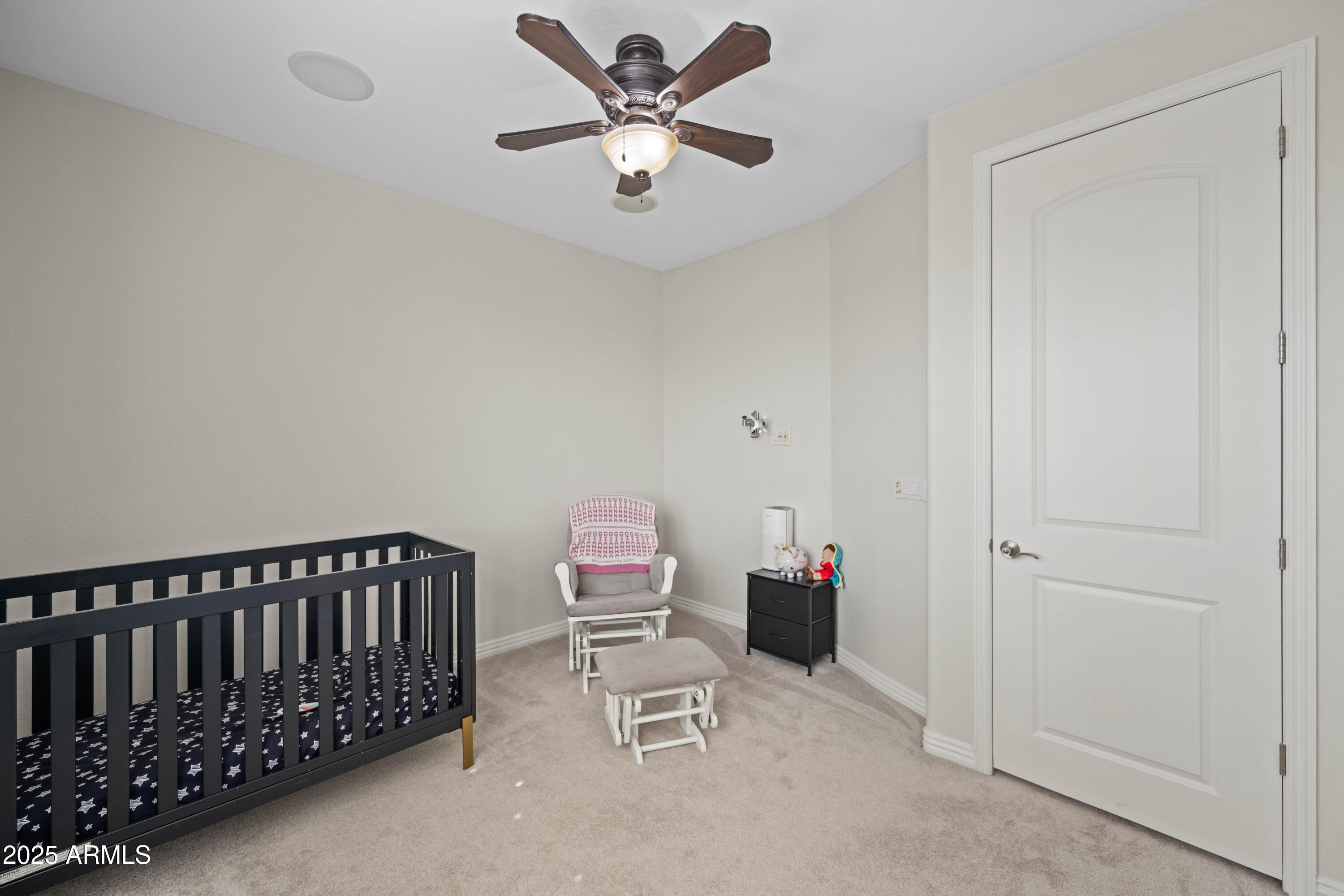 16880 West Jackson Street Goodyear, AZ 85338 - Photo 60 of 86 a bedroom with furniture and a ceiling fan