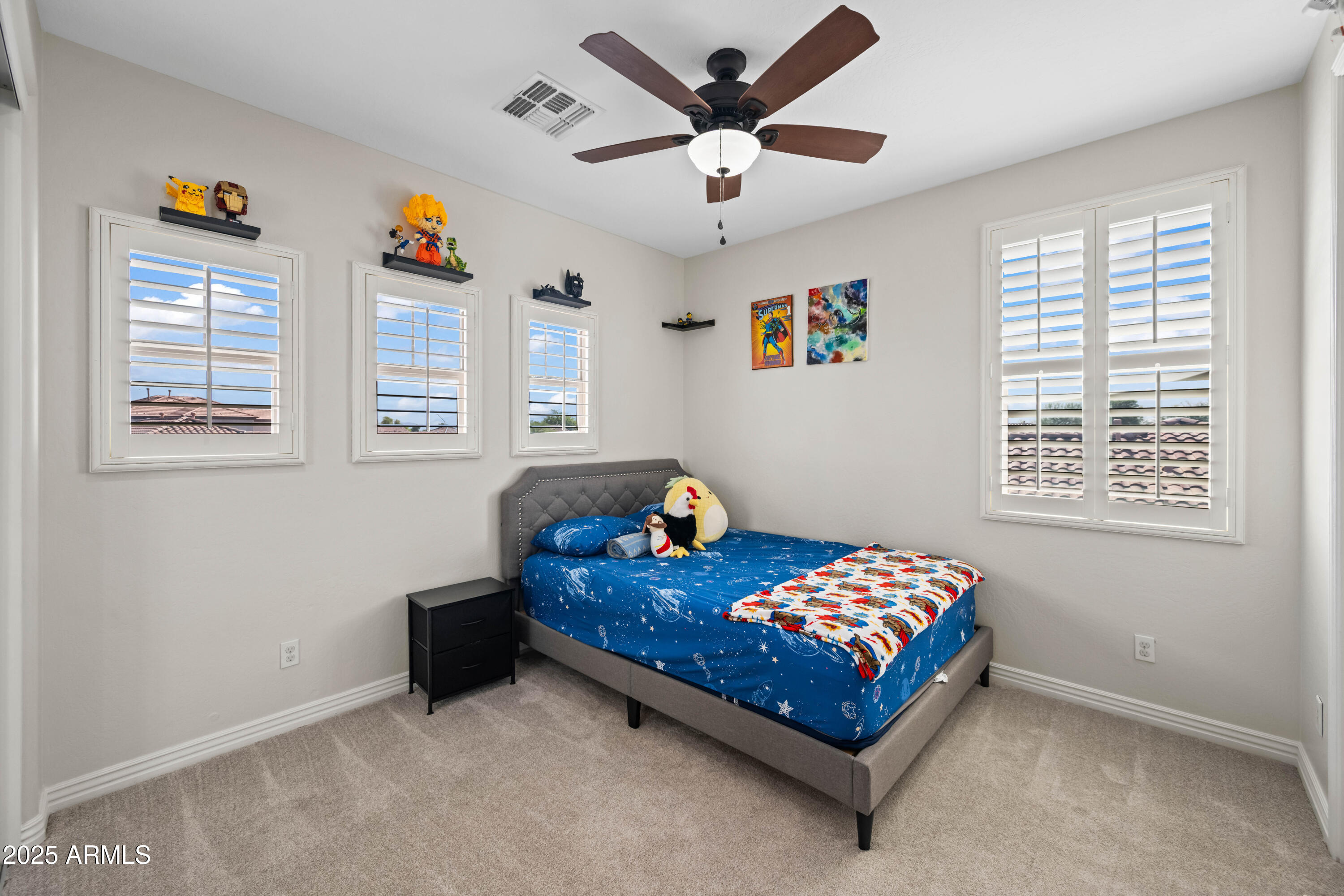 16880 West Jackson Street Goodyear, AZ 85338 - Photo 68 of 86 a bedroom with a bed and a window