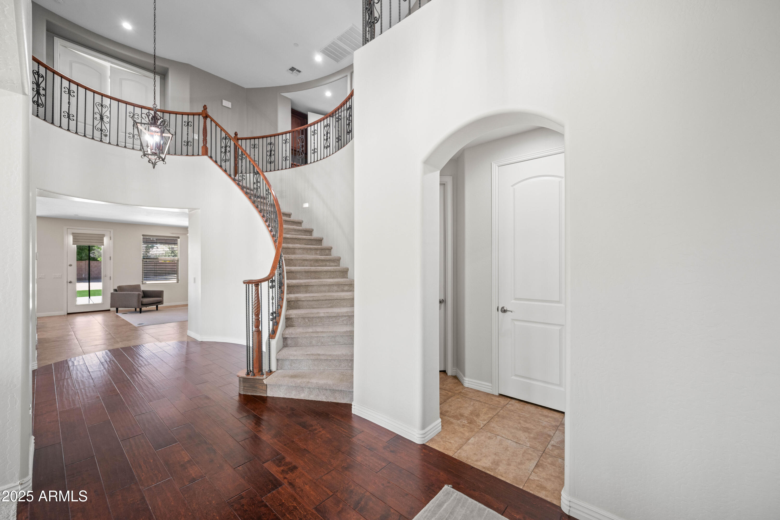 16880 West Jackson Street Goodyear, AZ 85338 - Photo 7 of 86 a view of entryway and hall with wooden floor
