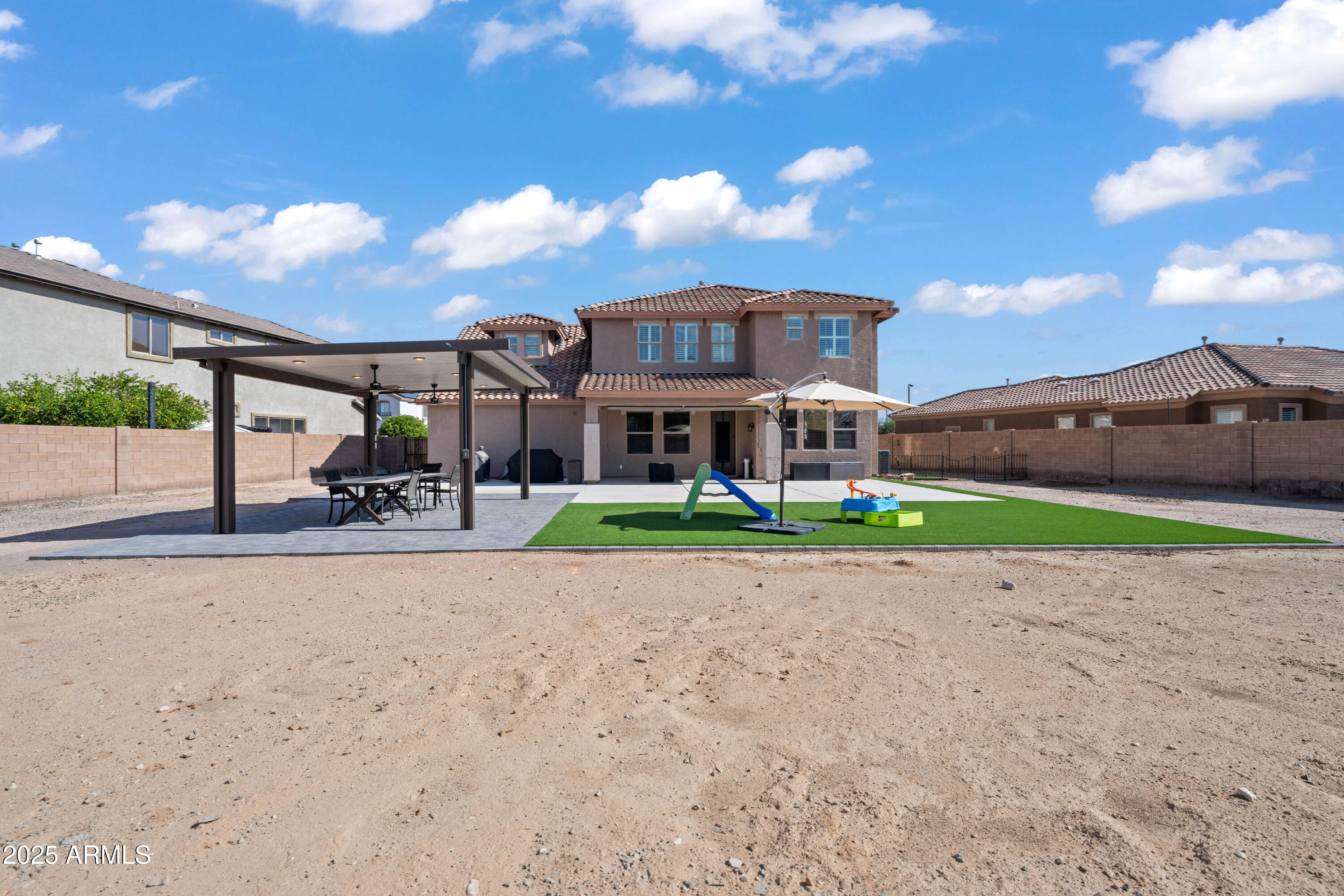 16880 West Jackson Street Goodyear, AZ 85338 - Photo 73 of 86 a front view of a house with a yard and entertaining space