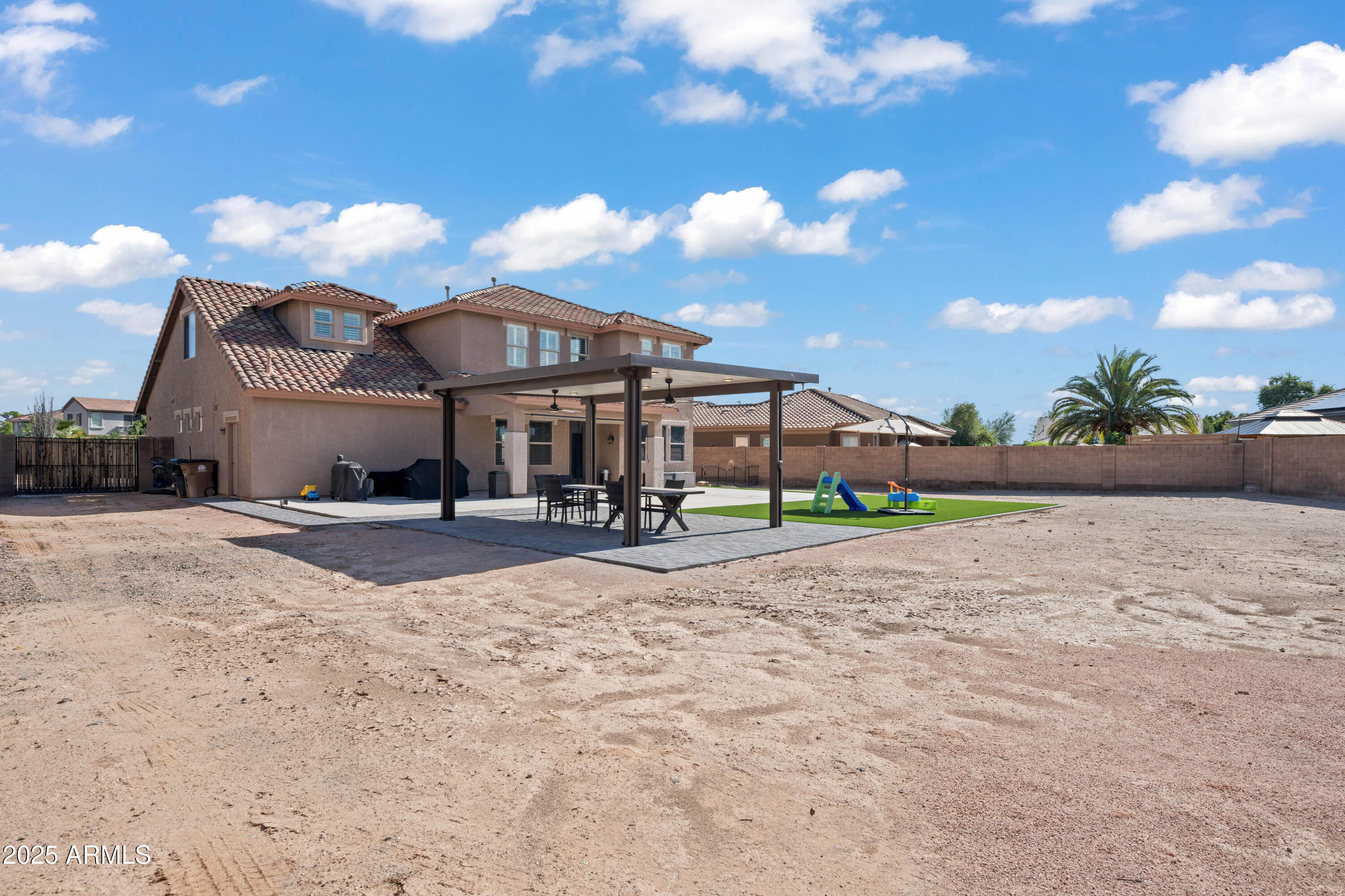 16880 West Jackson Street Goodyear, AZ 85338 - Photo 74 of 86 a front view of a house with a yard and garage