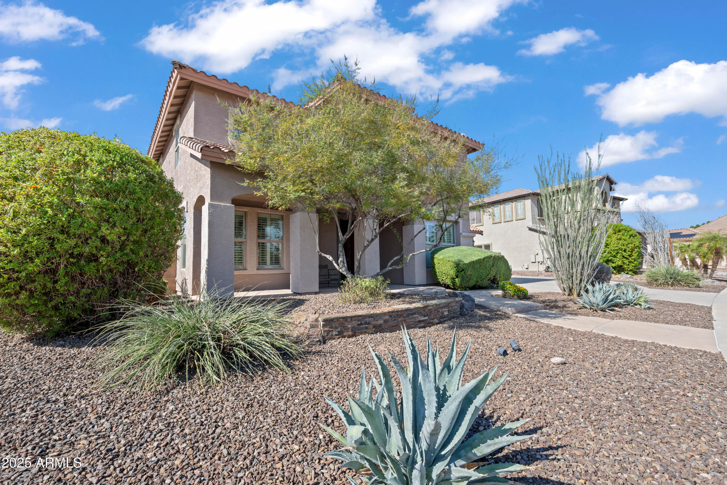 16880 West Jackson Street Goodyear, AZ 85338 - Photo 82 of 86 a view of a house with a tree in front