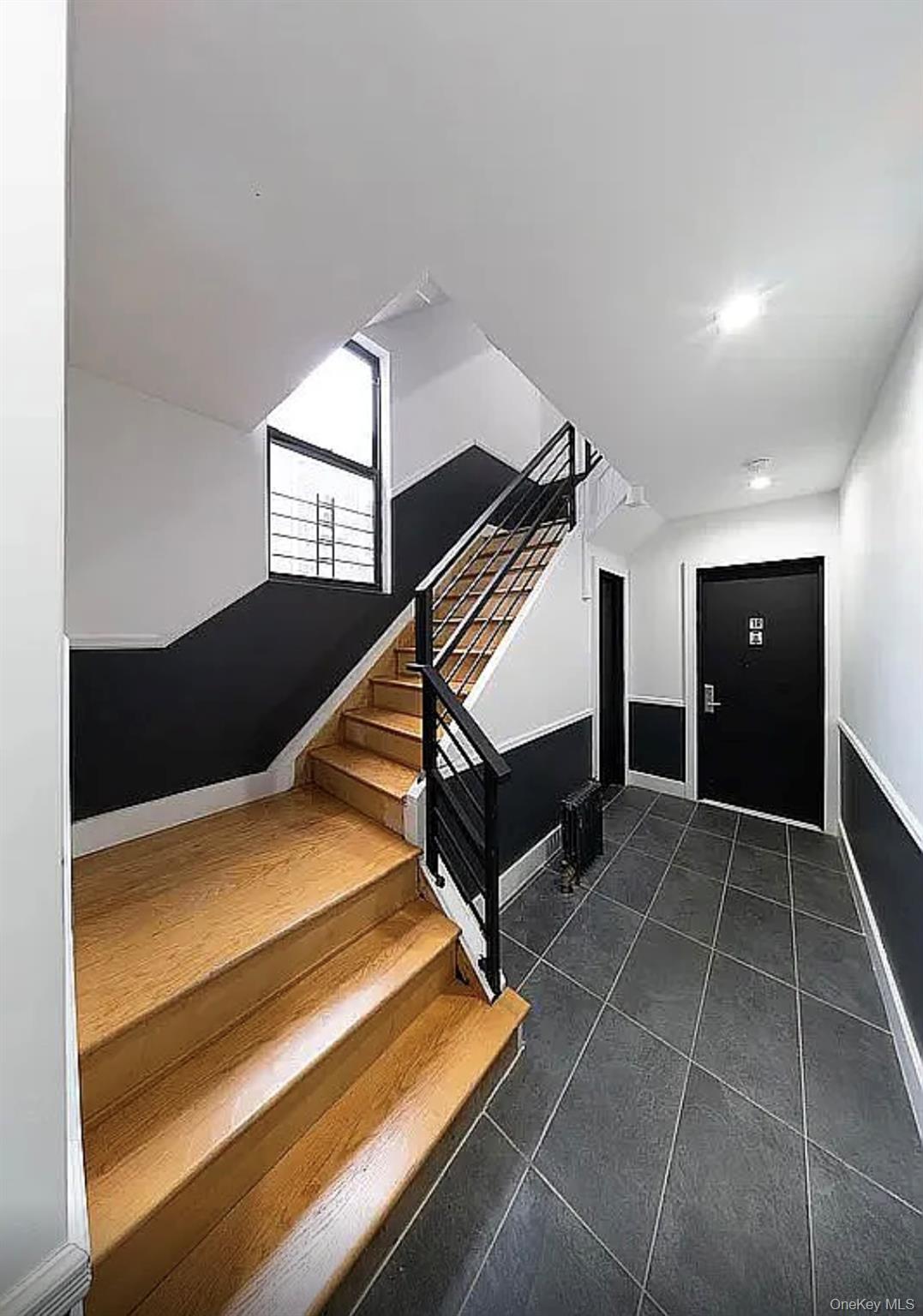 372 Rutland Road Brooklyn, NY 11225 - Photo 2 of 10 Staircase featuring tile patterned flooring and baseboards