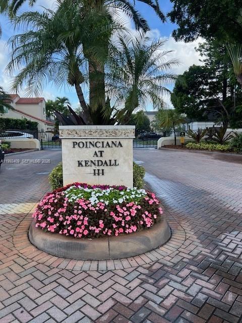 11841 Southwest 94th Street Miami, FL 33186 - Photo 13 of 19 a view of a wooden bench and sign board