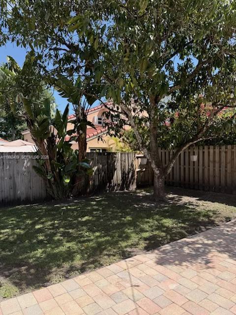 11841 Southwest 94th Street Miami, FL 33186 - Photo 17 of 19 a view of a backyard with tree