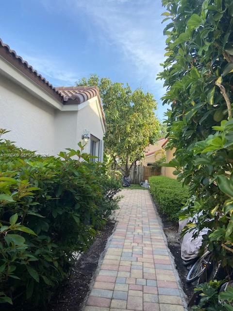 11841 Southwest 94th Street Miami, FL 33186 - Photo 19 of 19 a view of a pathway both side of the house