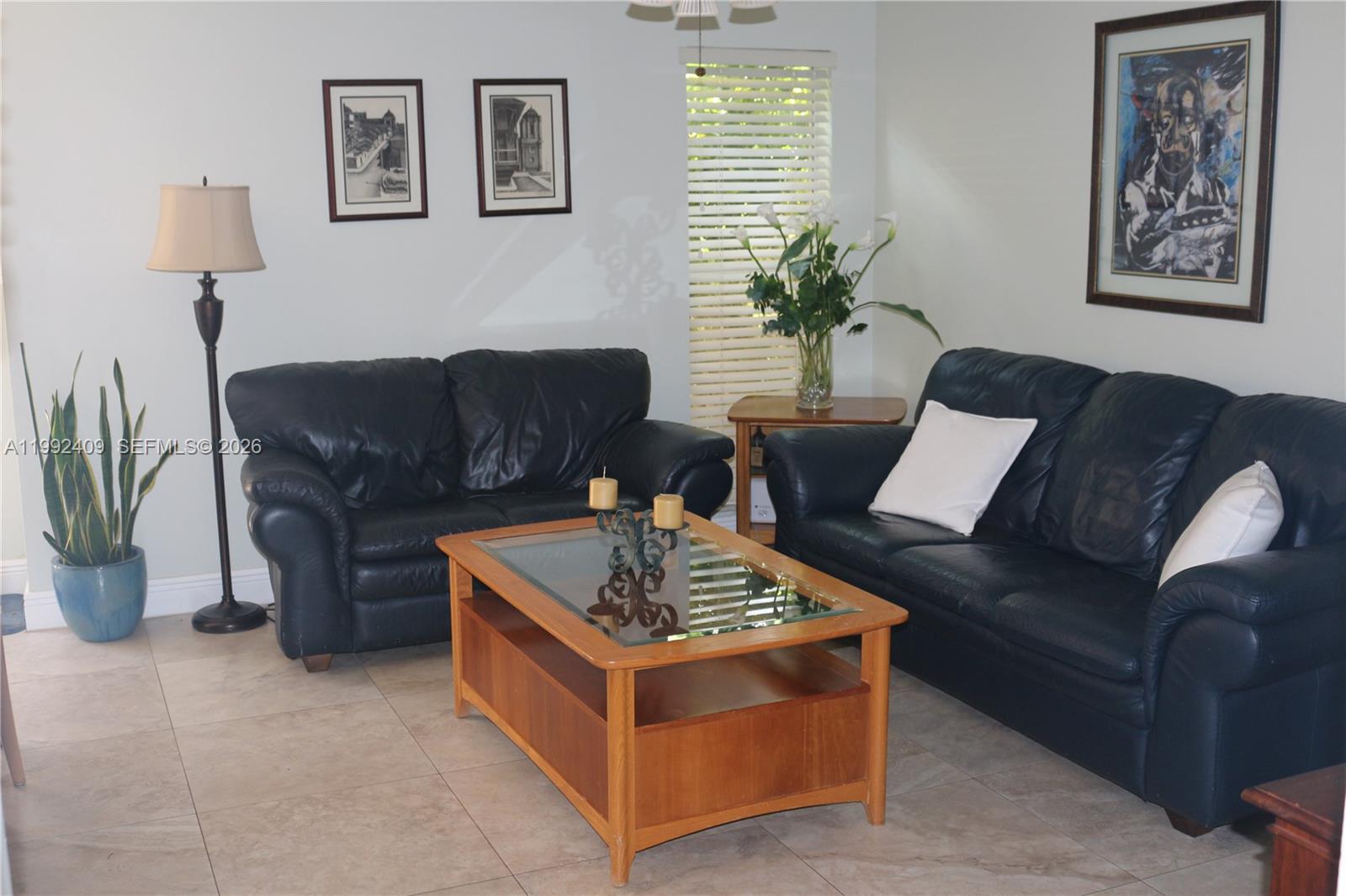 11841 Southwest 94th Street Miami, FL 33186 - Photo 6 of 19 a living room with furniture and a potted plant