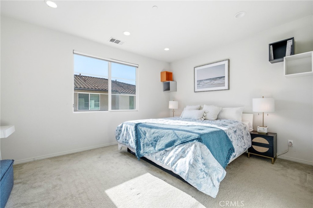 11130 Legion Loop, Unit 105 El Monte, CA 91731 - Photo 20 of 49 a bedroom with a bed and a window