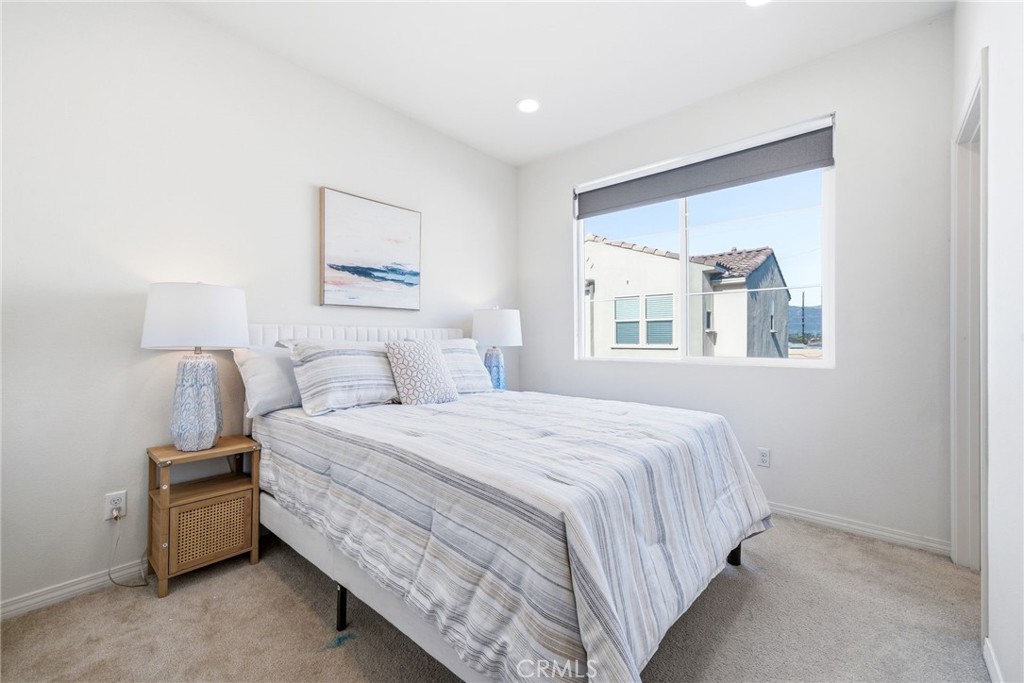 11130 Legion Loop, Unit 105 El Monte, CA 91731 - Photo 26 of 49 a bedroom with a bed and a window