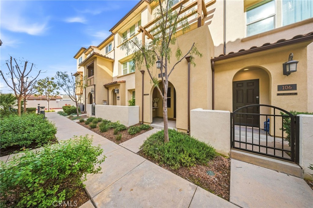 11130 Legion Loop, Unit 105 El Monte, CA 91731 - Photo 32 of 49 a front view of a house with garden