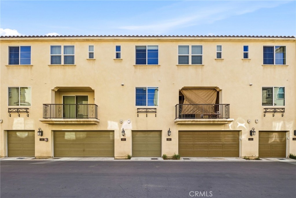 11130 Legion Loop, Unit 105 El Monte, CA 91731 - Photo 35 of 49 a front view of a house with a yard