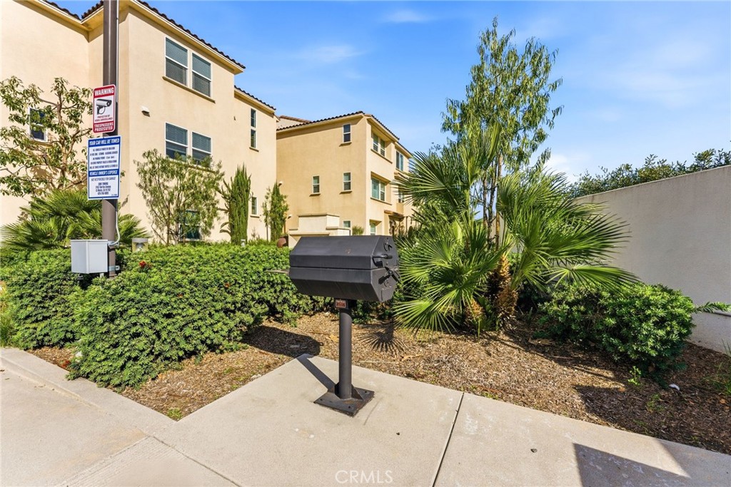 11130 Legion Loop, Unit 105 El Monte, CA 91731 - Photo 41 of 49 a backyard of a house with lots of green space