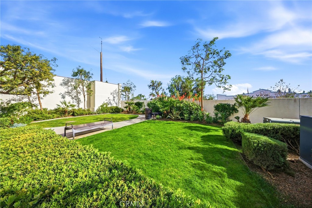 11130 Legion Loop, Unit 105 El Monte, CA 91731 - Photo 45 of 49 a view of a garden with a sign board