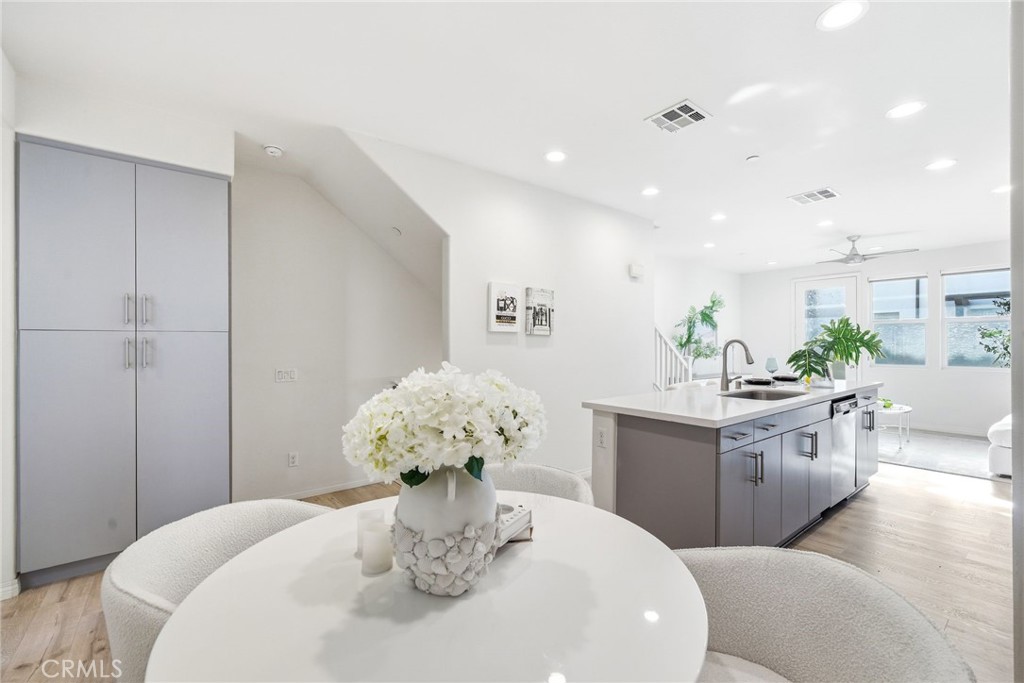 11130 Legion Loop, Unit 105 El Monte, CA 91731 - Photo 6 of 49 a dining room with furniture and chandelier