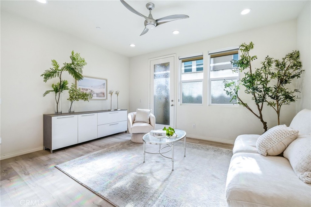 11130 Legion Loop, Unit 105 El Monte, CA 91731 - Photo 10 of 49 a living room with furniture and a potted plant