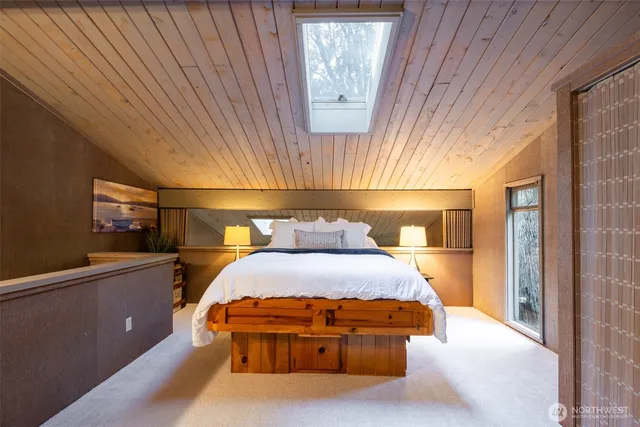 a bedroom with a bed and window