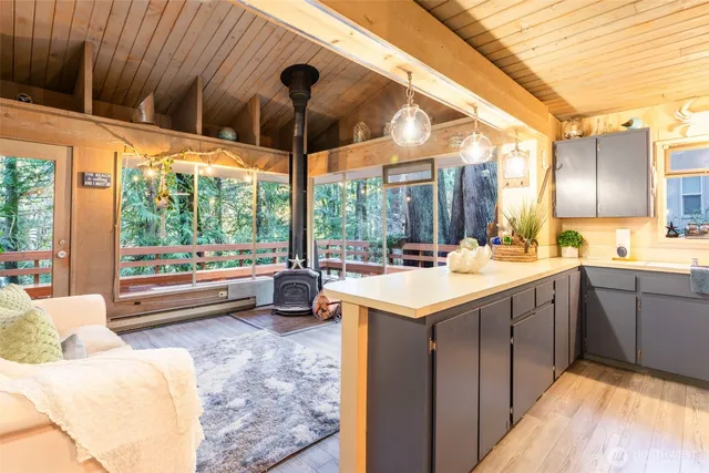 a kitchen with a sink and large window